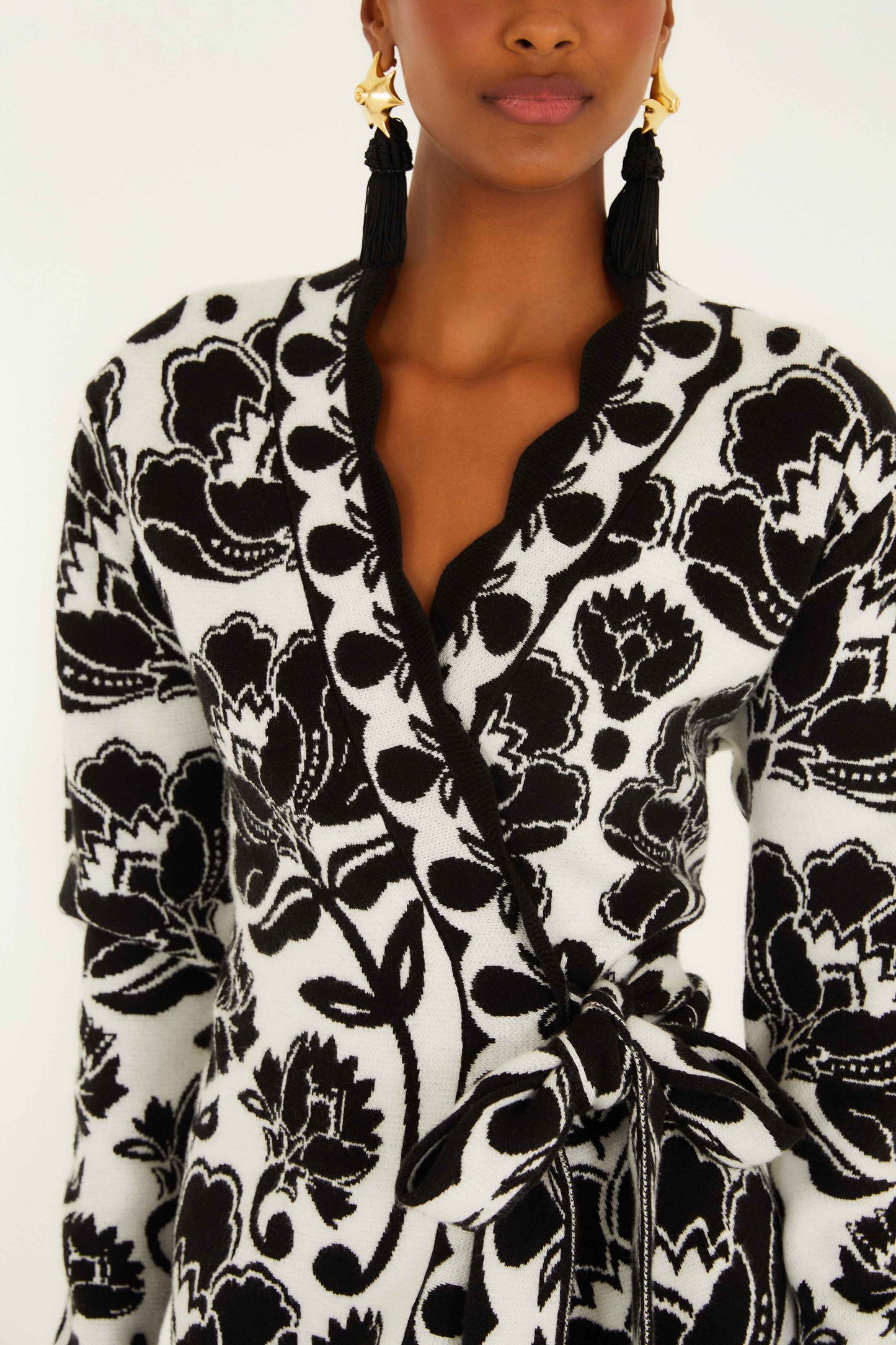 FARM Rio model wearing the Black & White Floral Arabesque Knit Wrap Dress