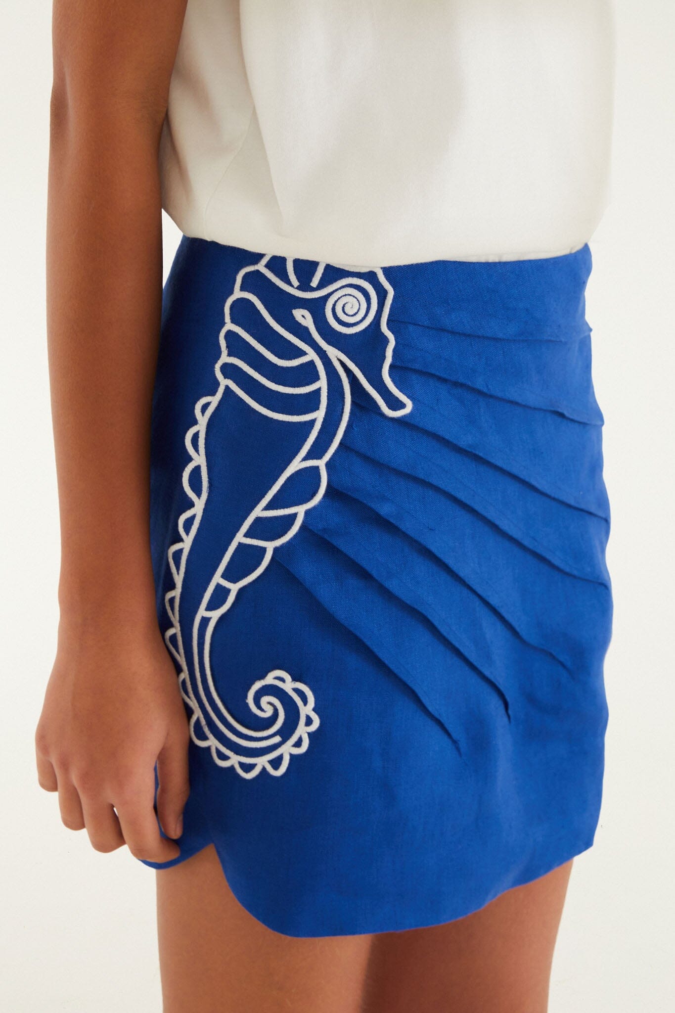 FARM Rio model wearing the Blue Seahorse Embroidery Euroflax Premium Linen Mini Skirt