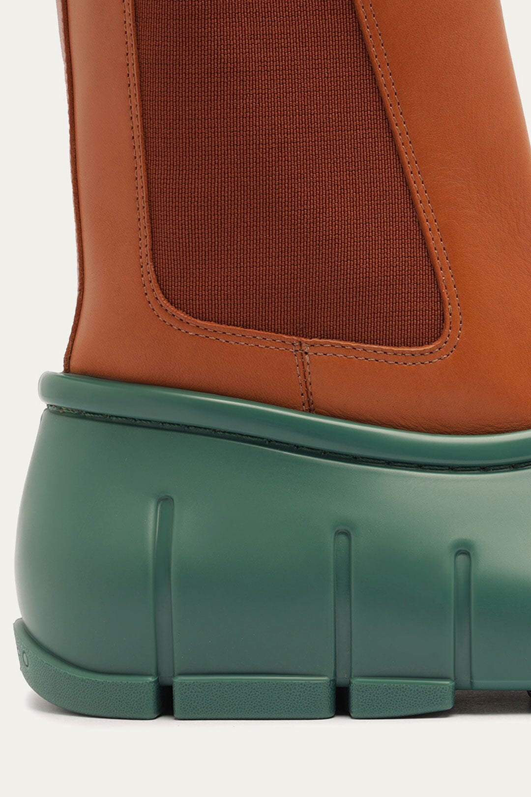 FARM Rio model wearing the Forest Green Monstera Rain Chelsea Boot