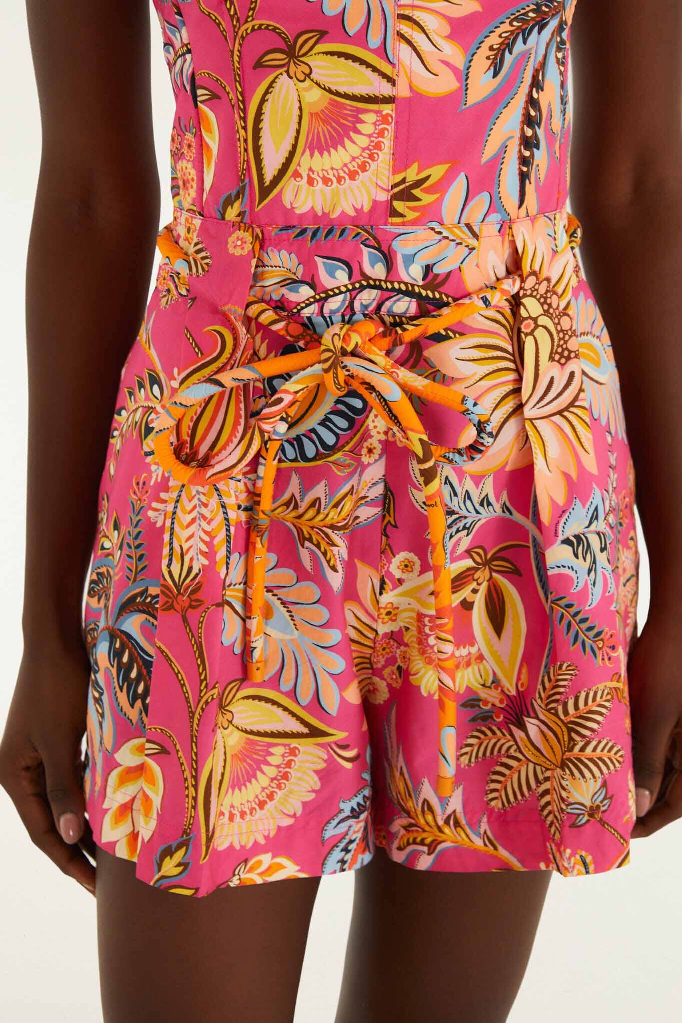 FARM Rio model wearing the Pink Ligia Floral Drawstring Organic Cotton Romper