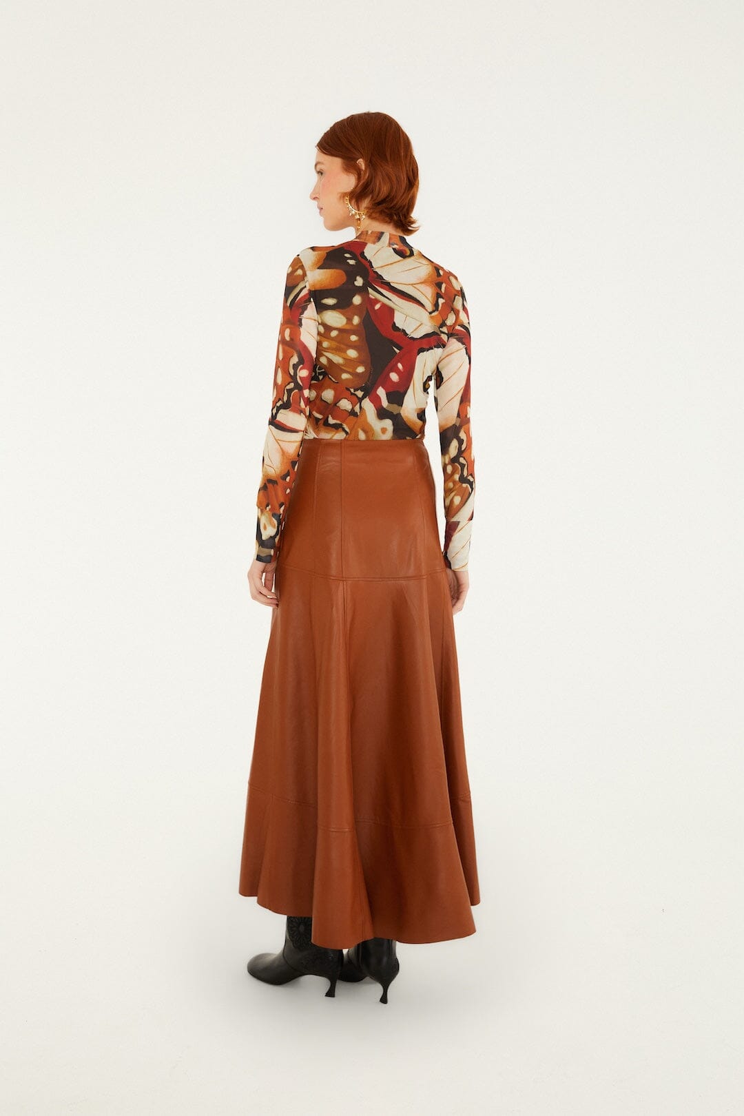 FARM Rio model wearing the Pleats Leather Midi Skirt