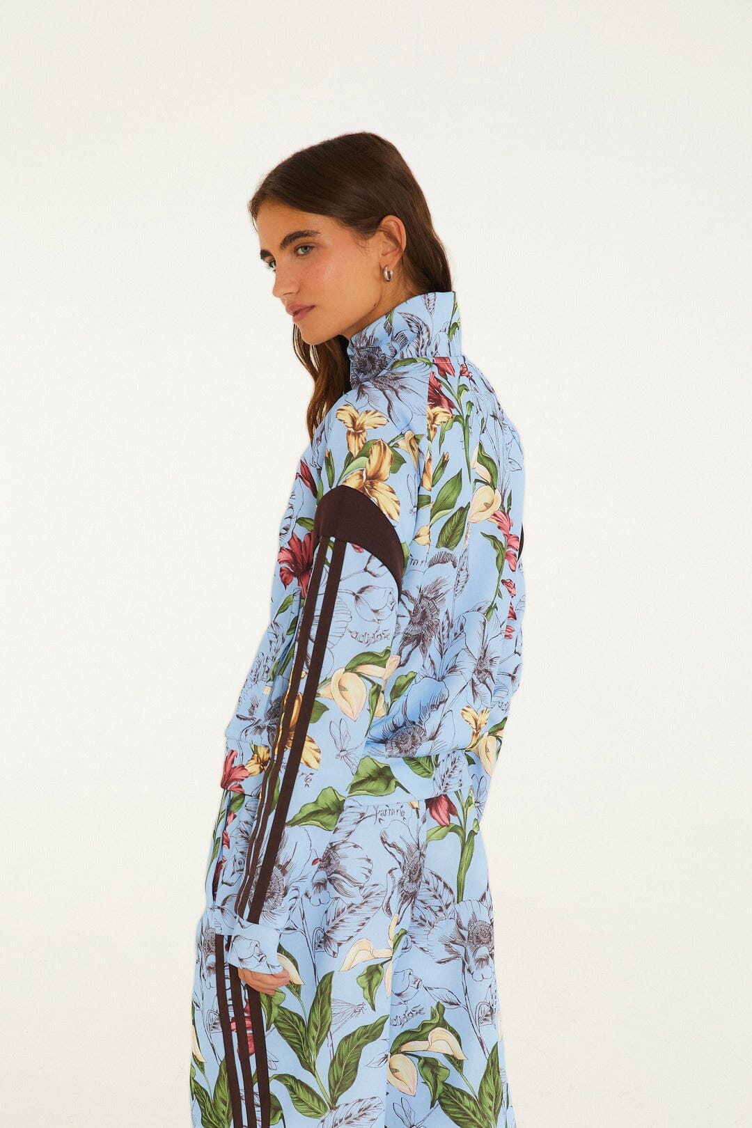FARM Rio model wearing the Sketch Floral Blue Adidas Tiro Jacket