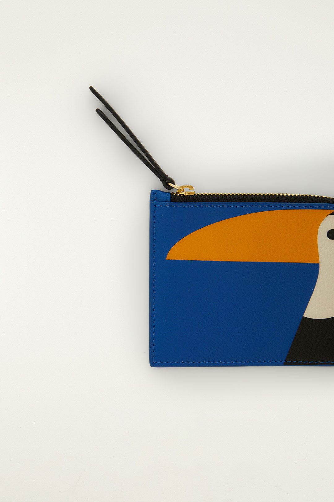 FARM Rio model wearing the Toucan Wallet