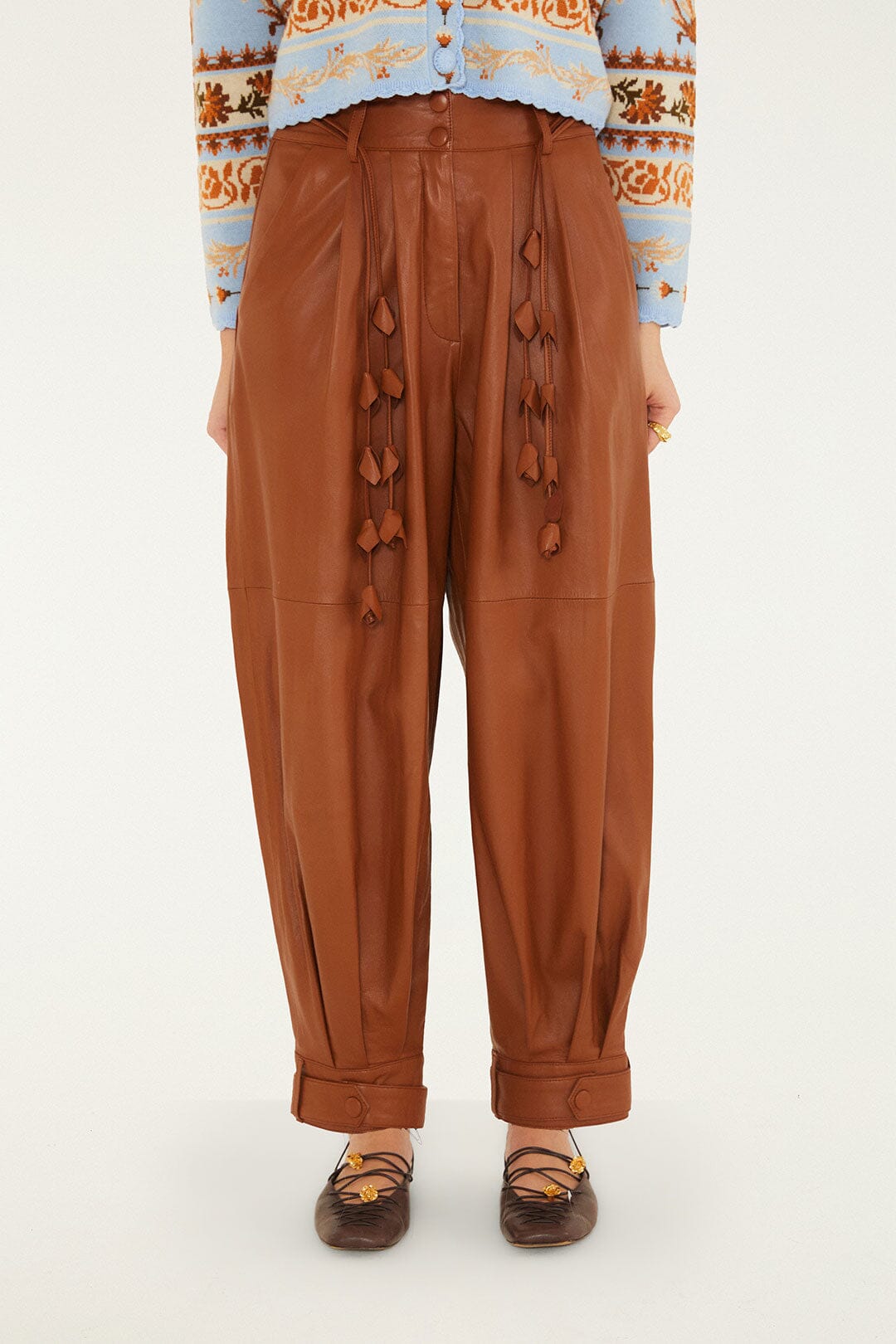 FARM Rio model wearing the Almost Famous Leather Pants