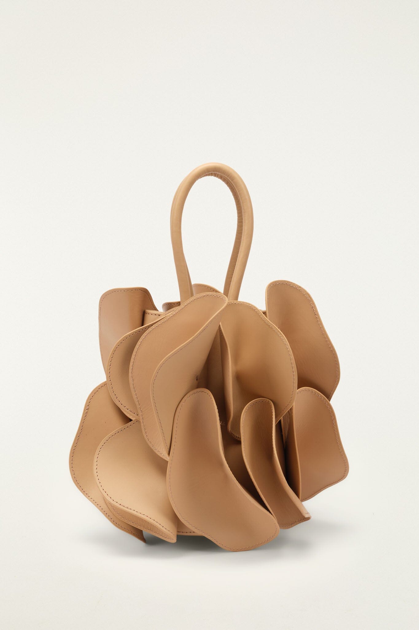 FARM Rio model wearing the Beige Leather Flower Handbag