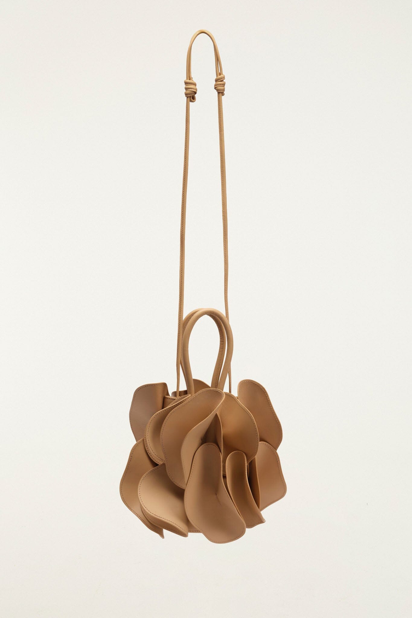 FARM Rio model wearing the Beige Leather Flower Handbag