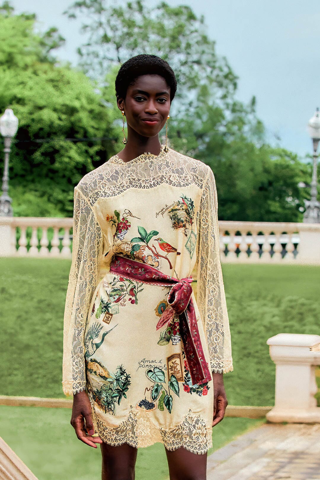 FARM Rio model wearing the Bird Poetry Long Sleeve Mini Dress
