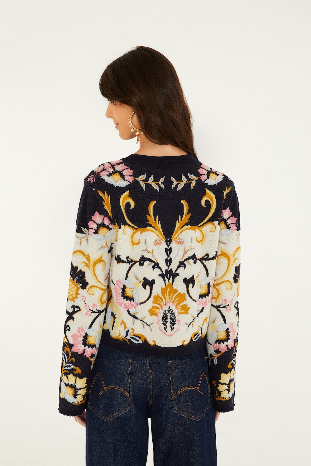 FARM Rio model wearing the Birds Romance Buttoned Knit Cardigan