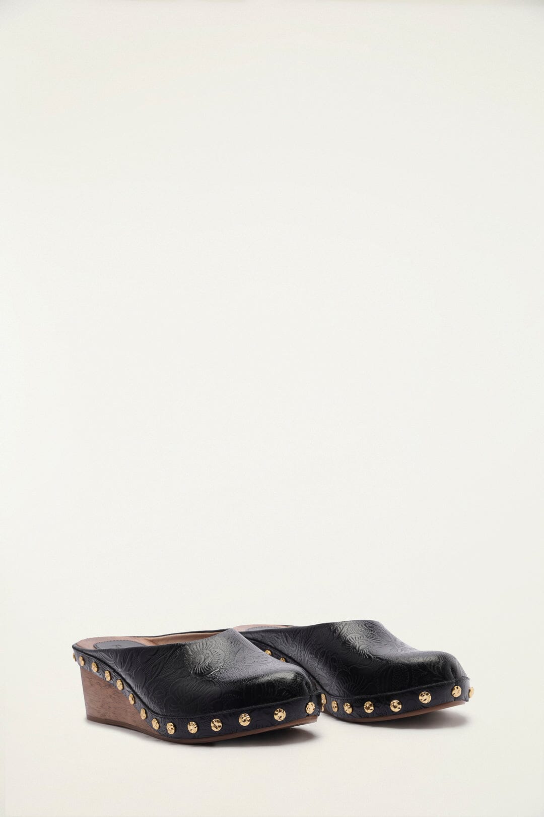 FARM Rio model wearing the Black Embossed Wedge Clog