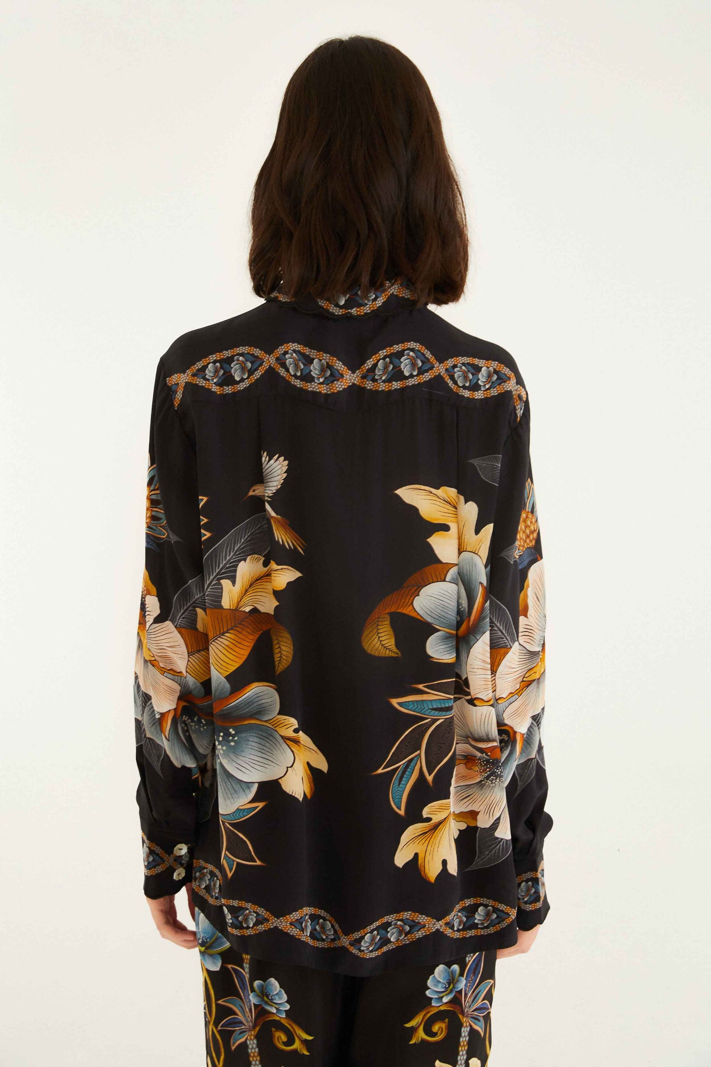 FARM Rio model wearing the Black Floral Snake Pajama Shirt