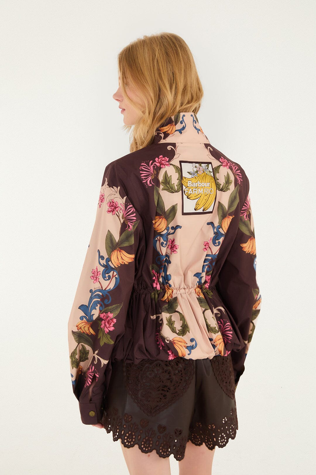 FARM Rio model wearing the Bloom In Between Drawstring Raincoat