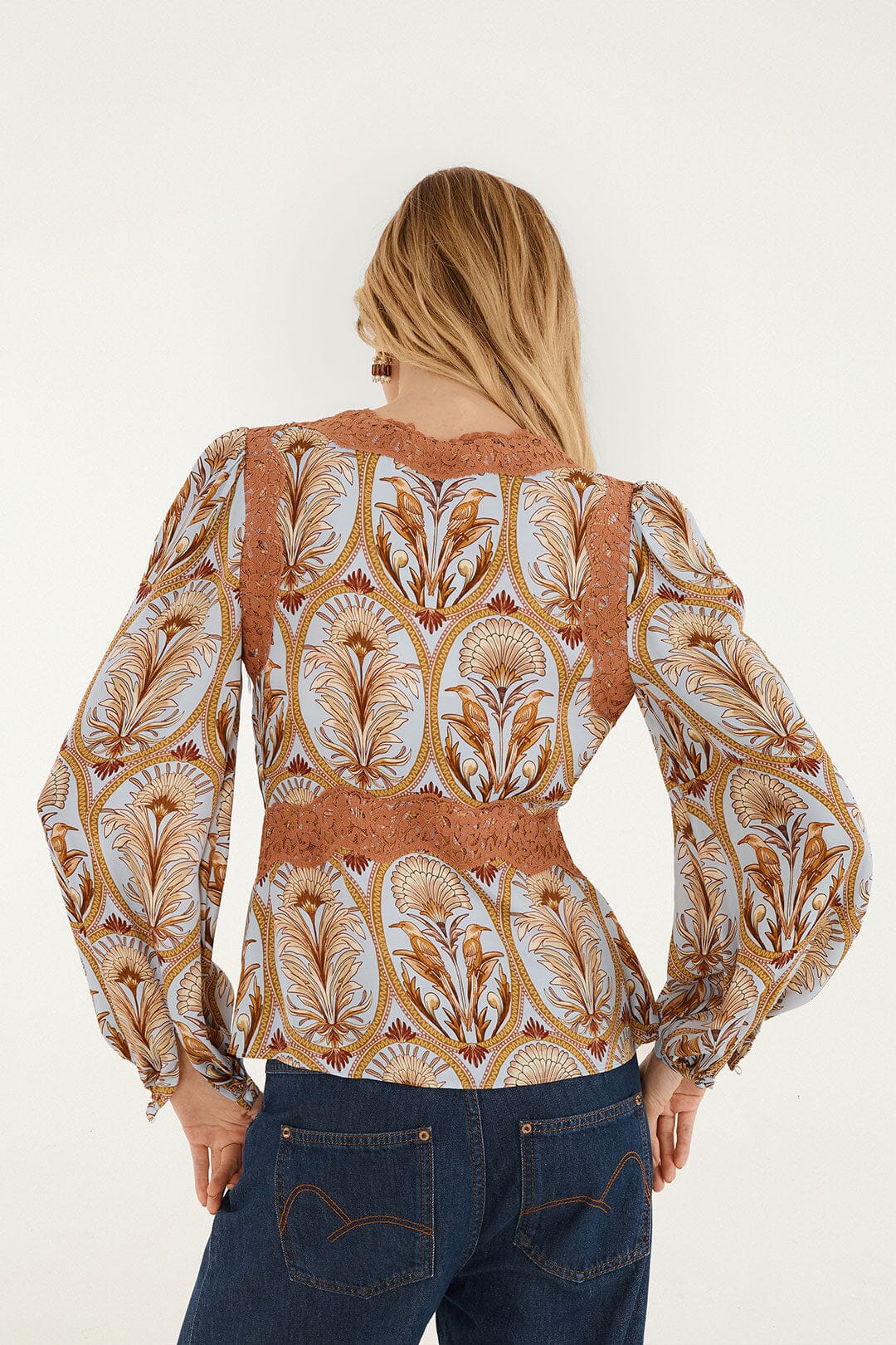 FARM Rio model wearing the Blooming Garden Long Sleeve Blouse