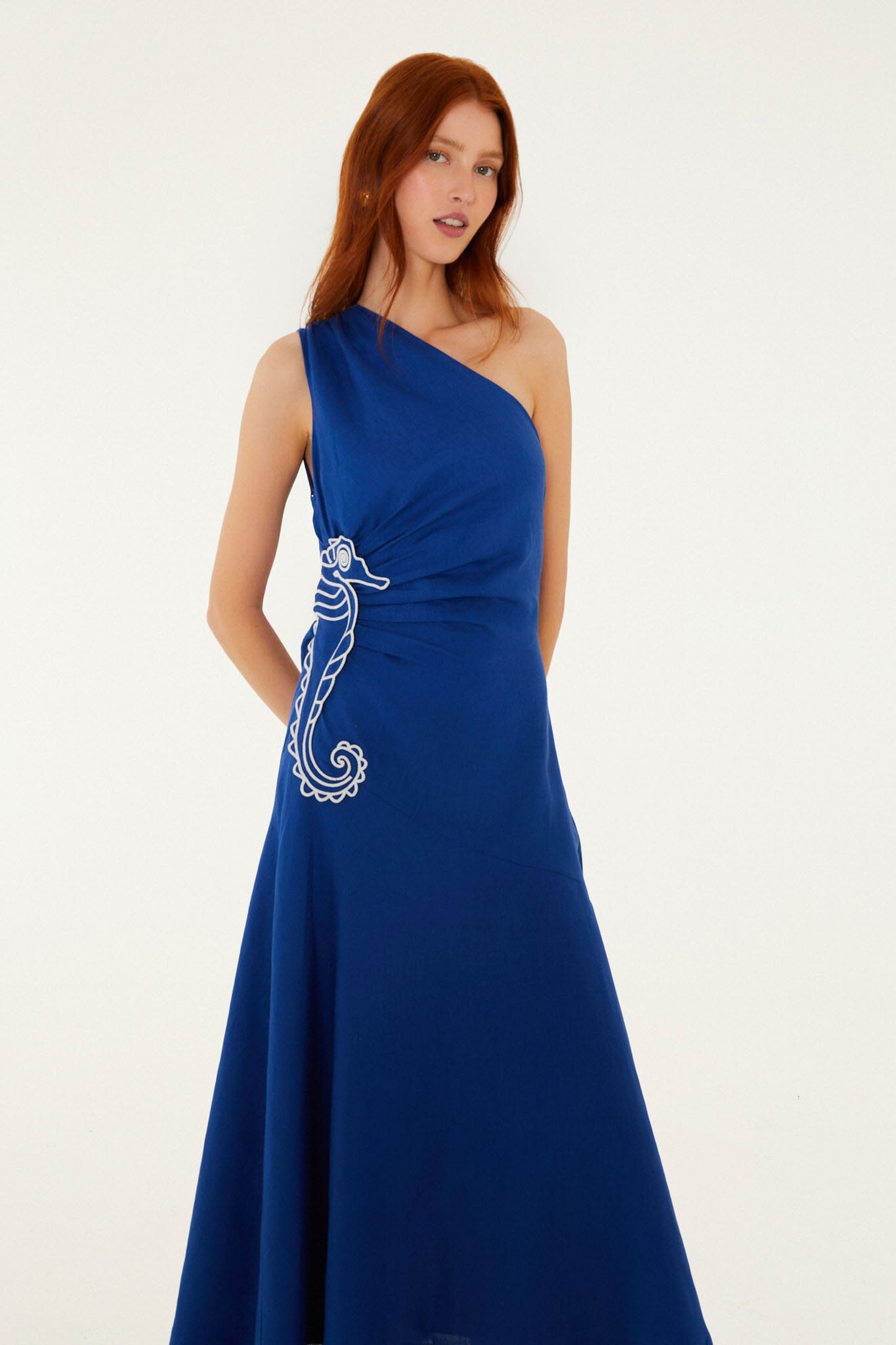 FARM Rio model wearing the Blue Seahorse Embroidery One-Shoulder Euroflax Premium Linen Maxi Dress