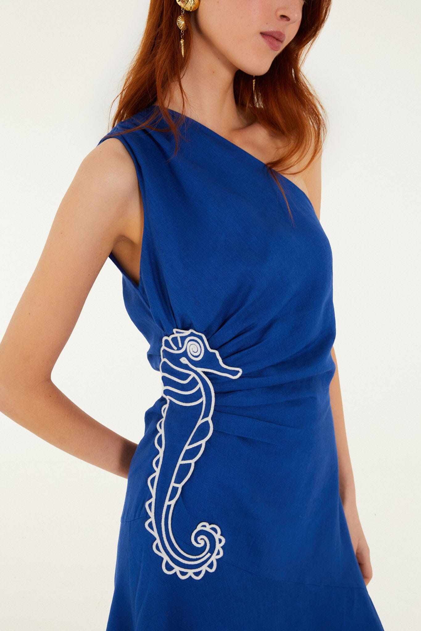 FARM Rio model wearing the Blue Seahorse Embroidery One-Shoulder Euroflax Premium Linen Maxi Dress