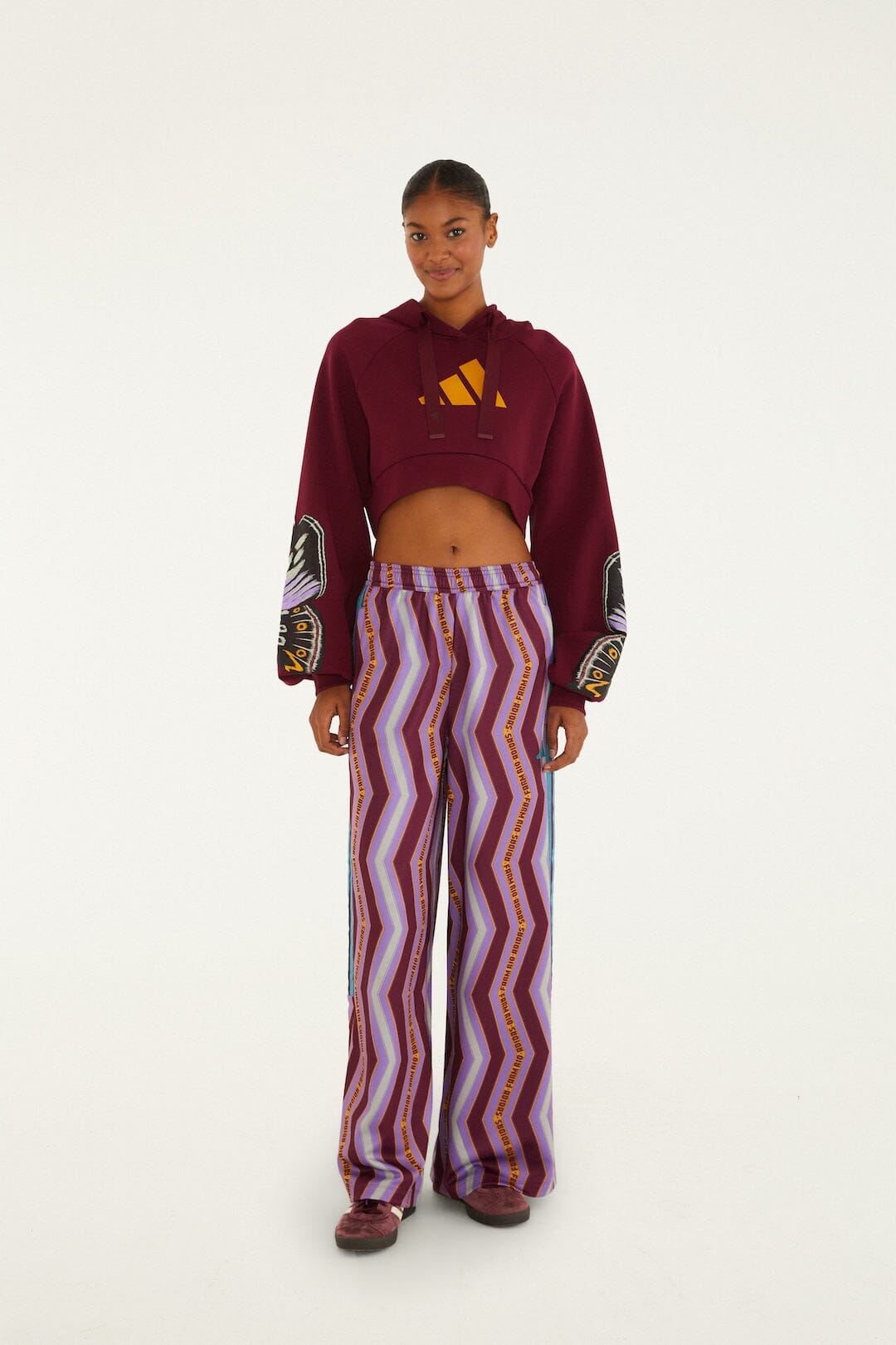 FARM Rio model wearing the Colorfly Adidas Amazon Red Hoodie