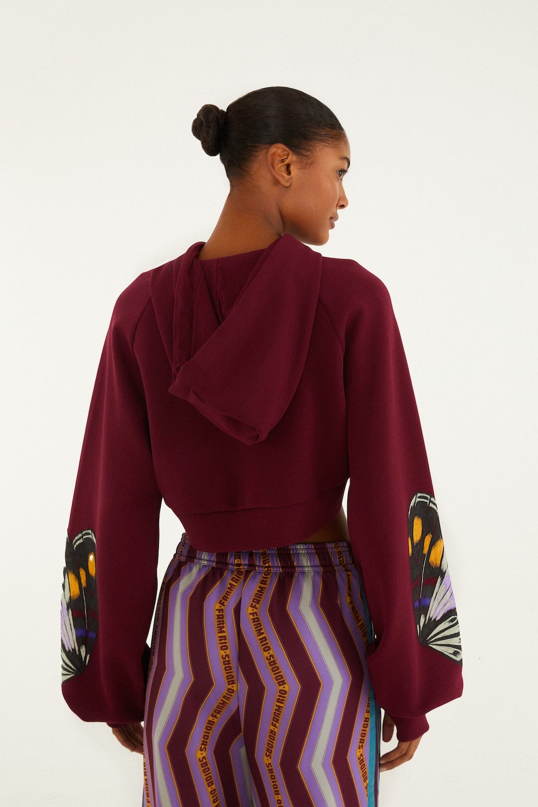 FARM Rio model wearing the Colorfly Adidas Amazon Red Hoodie