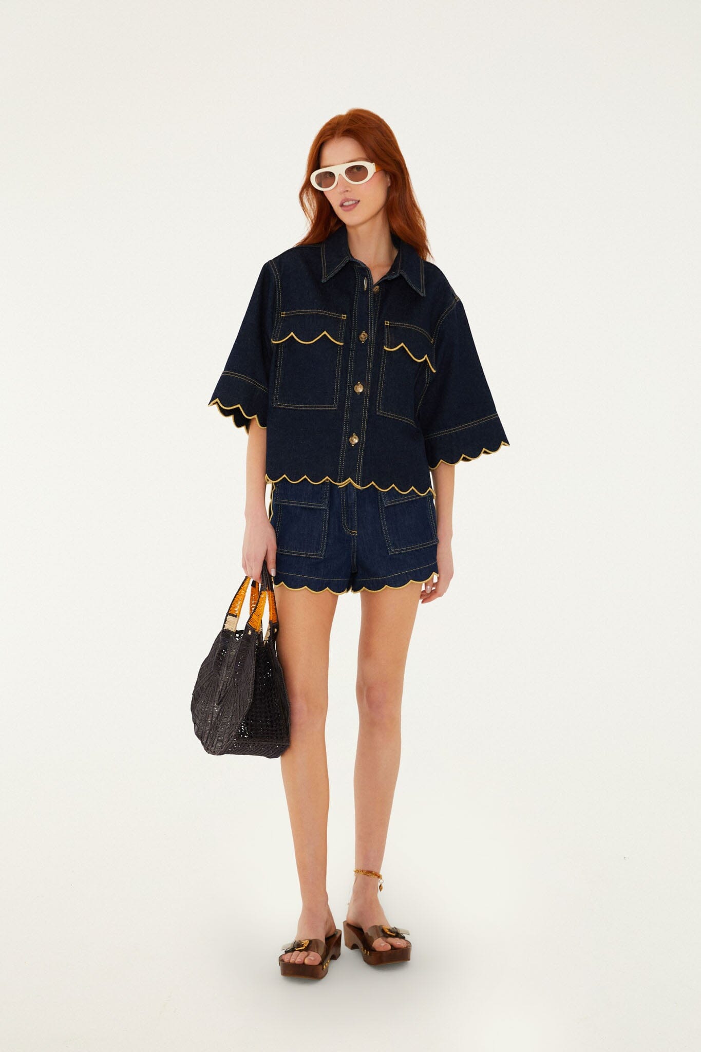 FARM Rio model wearing the Dark Denim Pockets Wavy Hem Shorts