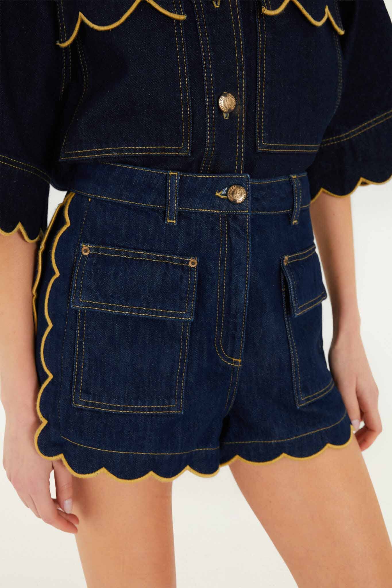 FARM Rio model wearing the Dark Denim Pockets Wavy Hem Shorts