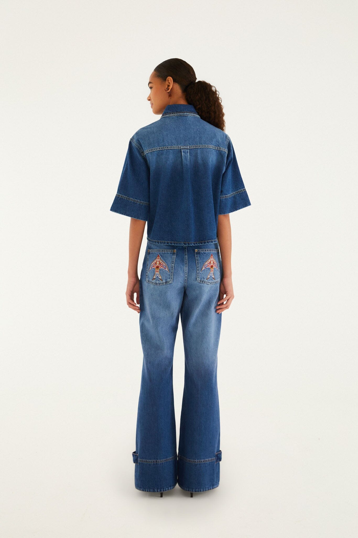 FARM Rio model wearing the Denim Porcelain Birds Pockets Flare Pants