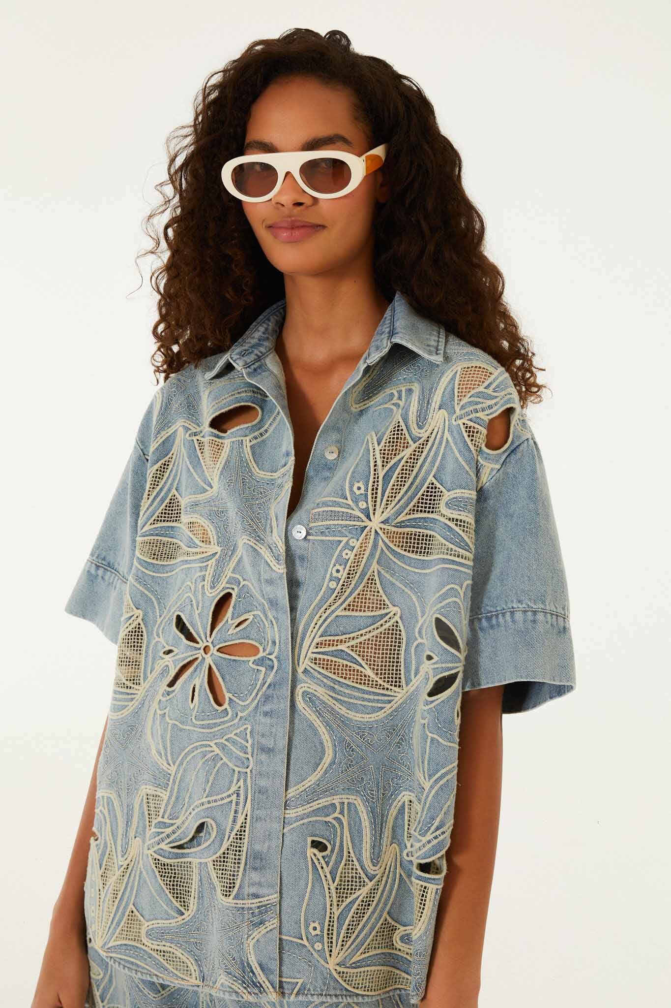 FARM Rio model wearing the Denim Sea Desire Embroidered Short Sleeve Shirt