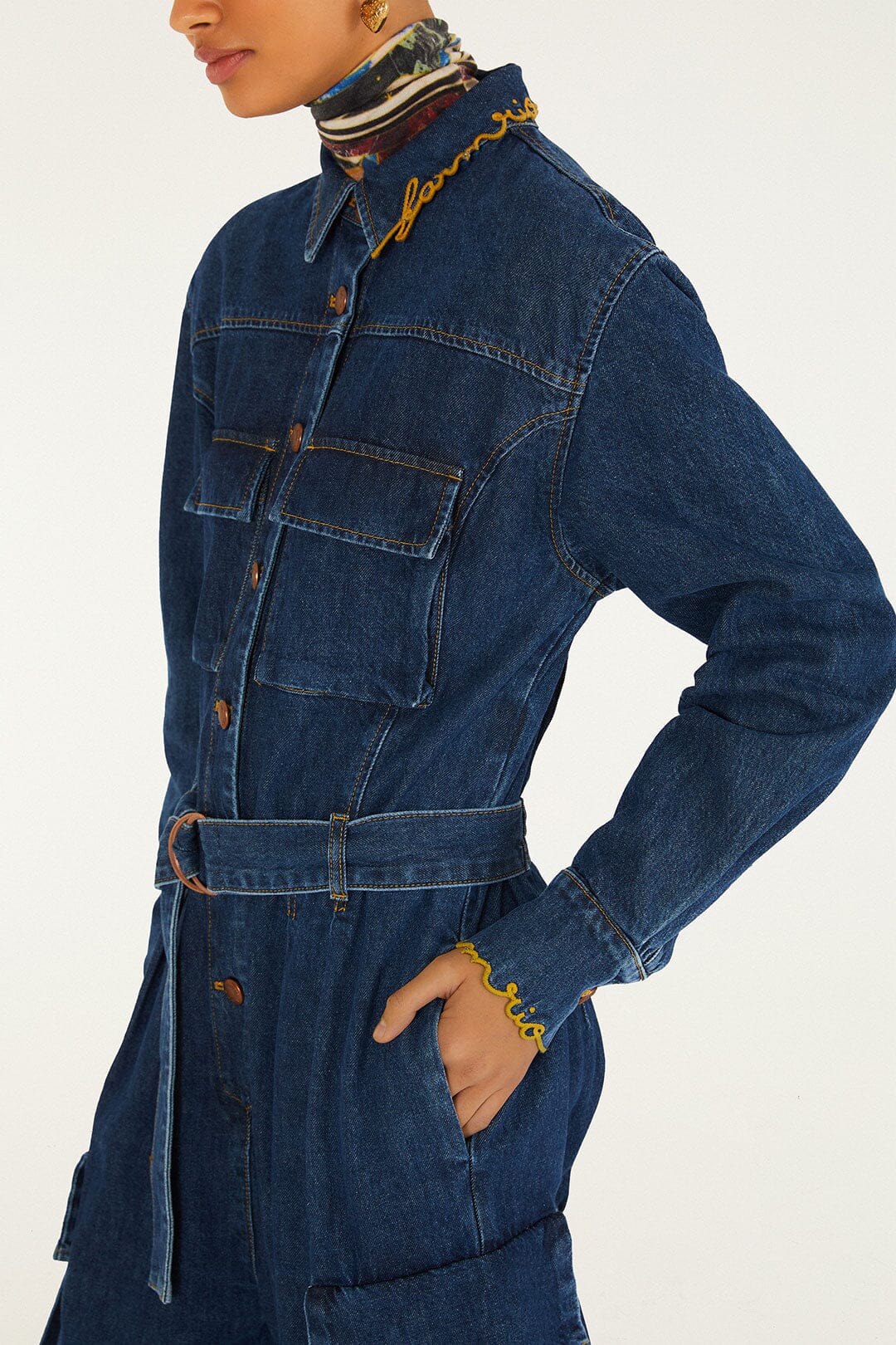 FARM Rio model wearing the Flores De Mármore Denim Jumpsuit