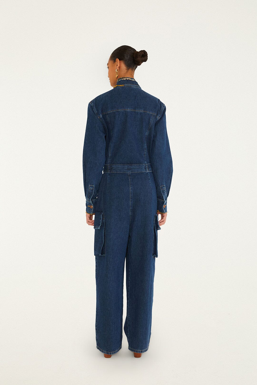 FARM Rio model wearing the Flores De Mármore Denim Jumpsuit