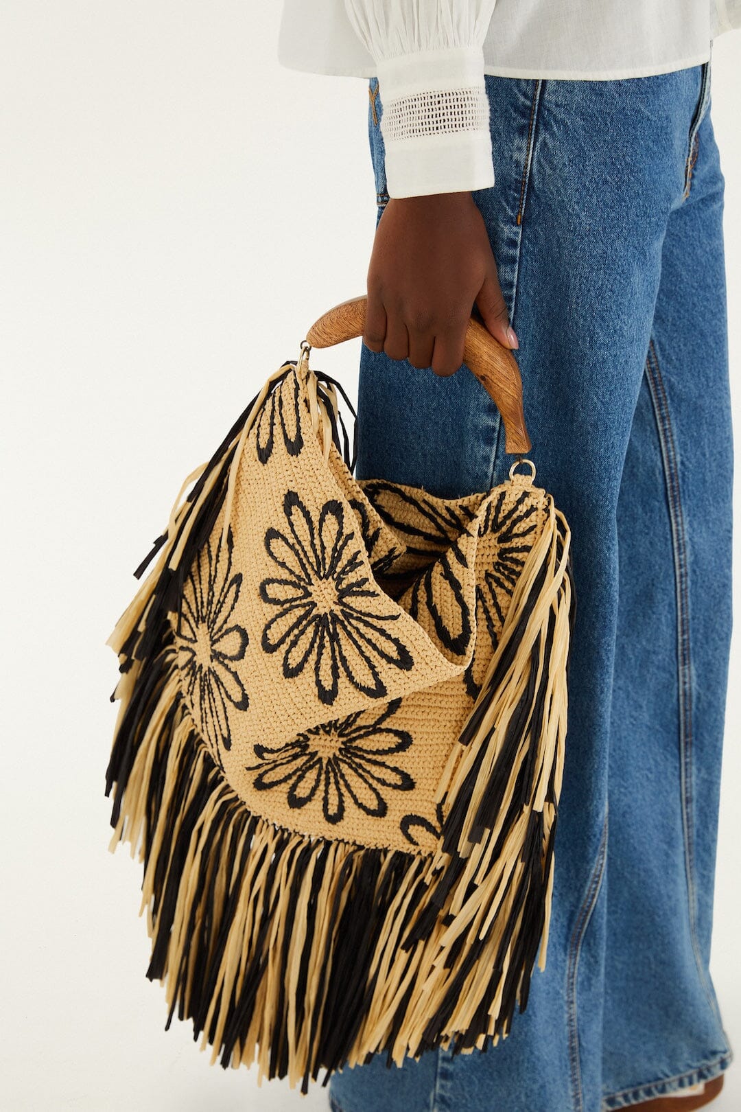 FARM Rio model wearing the Fringed Raffia Mini Bag