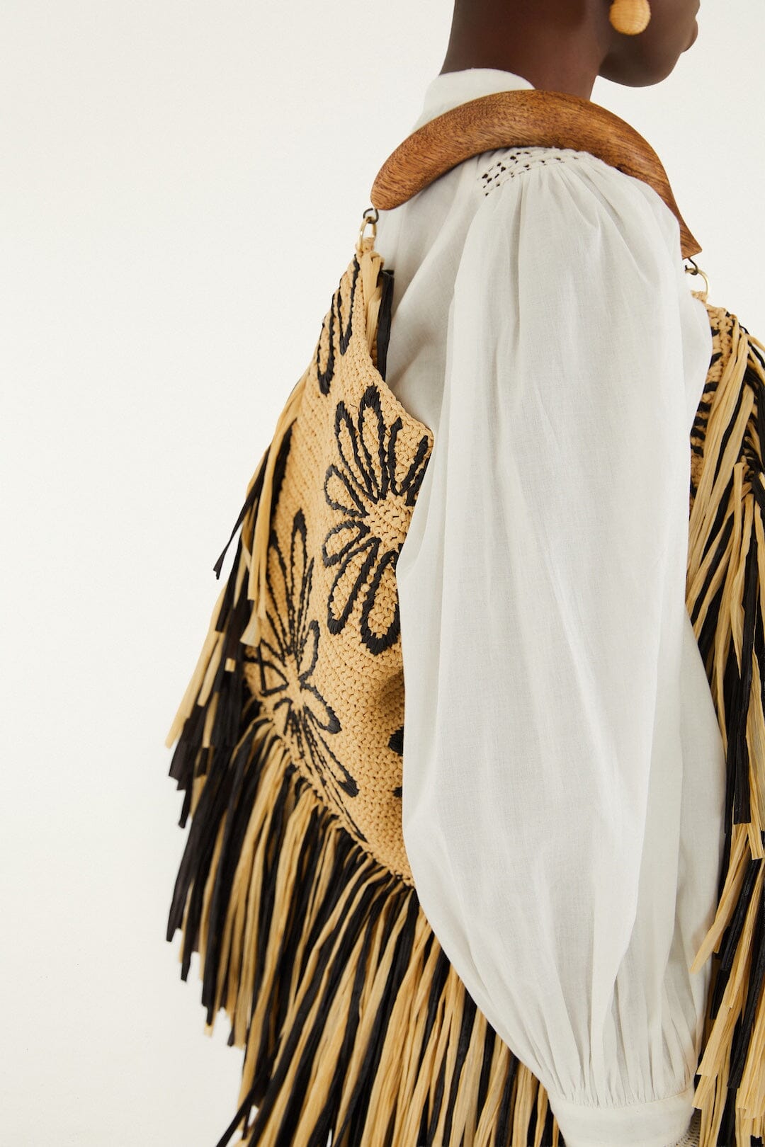 FARM Rio model wearing the Fringed Raffia Mini Bag
