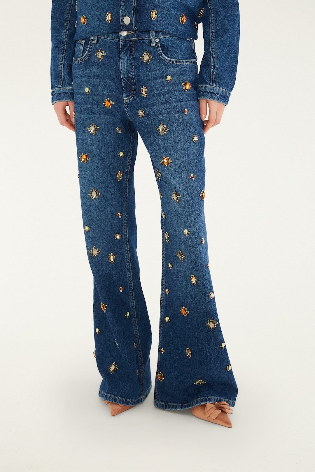 FARM Rio model wearing the Golden Gems Denim Flared Trousers