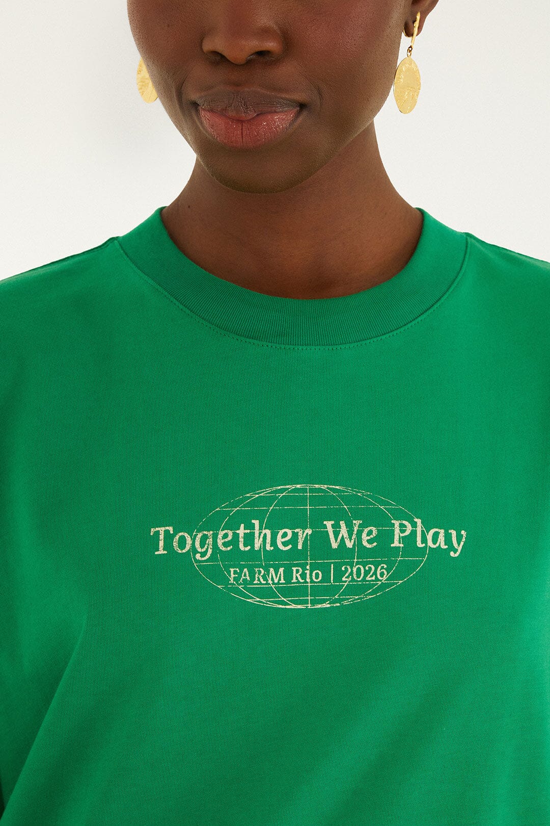 FARM Rio model wearing the Green Together We Play Short Sleeve T-Shirt