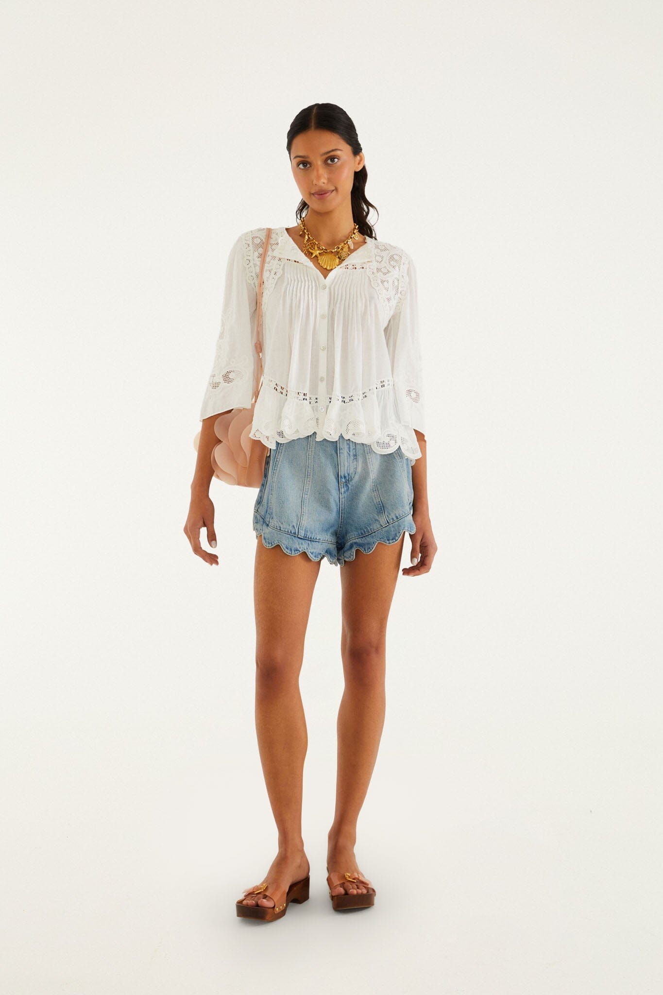 FARM Rio model wearing the Light Denim Romantic Wavy Hem Shorts