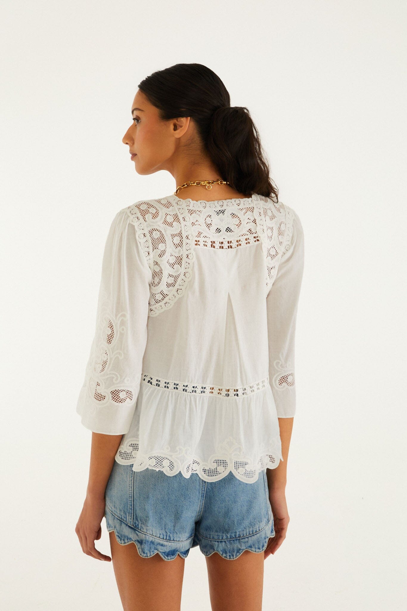 FARM Rio model wearing the Light Denim Romantic Wavy Hem Shorts