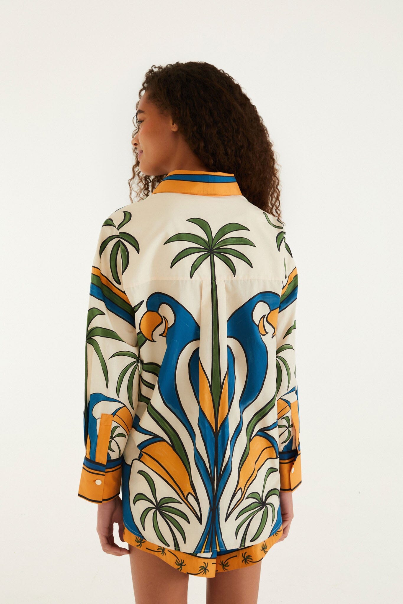 FARM Rio model wearing the Multicolor Tropical Graphic Collared Buttoned Shirt