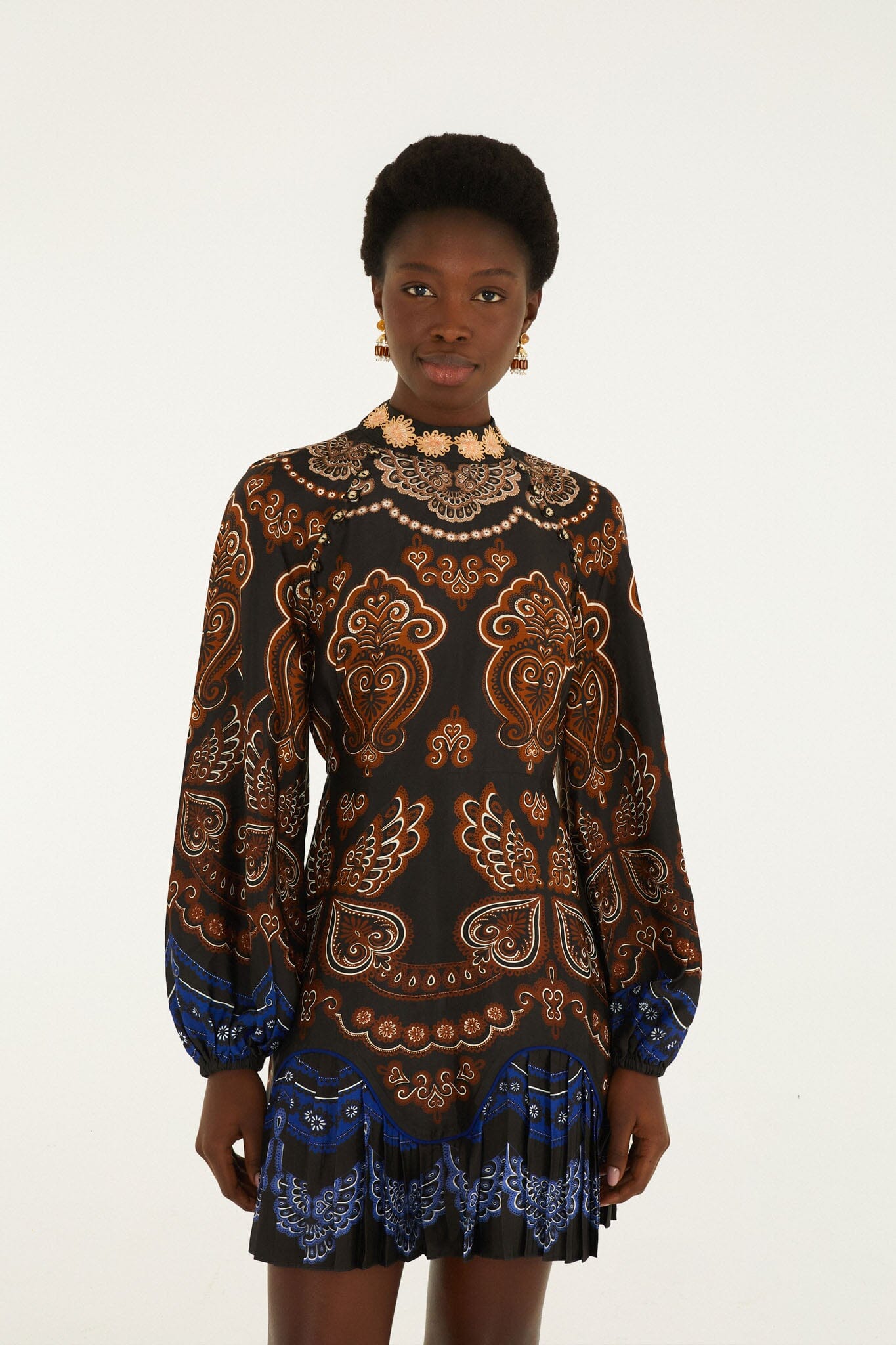 FARM Rio model wearing the Nicole Ruffled Long Sleeve Mini Dress