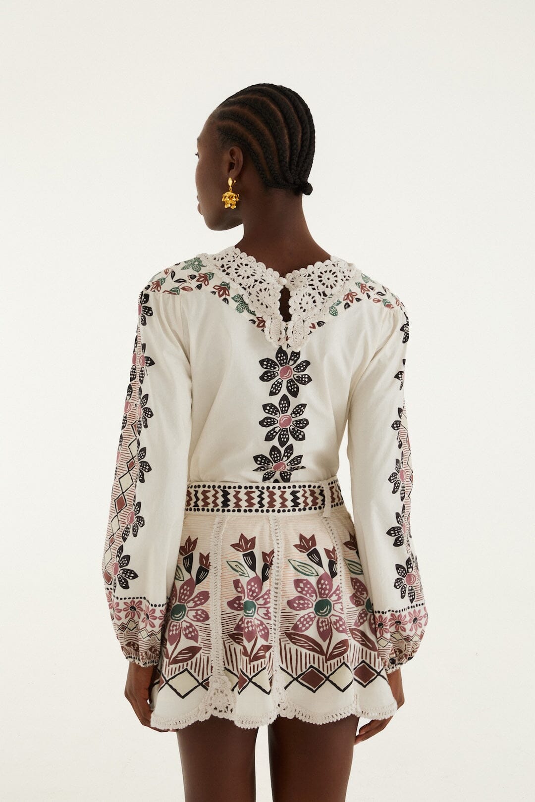 FARM Rio model wearing the Off-White Ainika Rustic Flowers Crochet Detail Mini Skirt