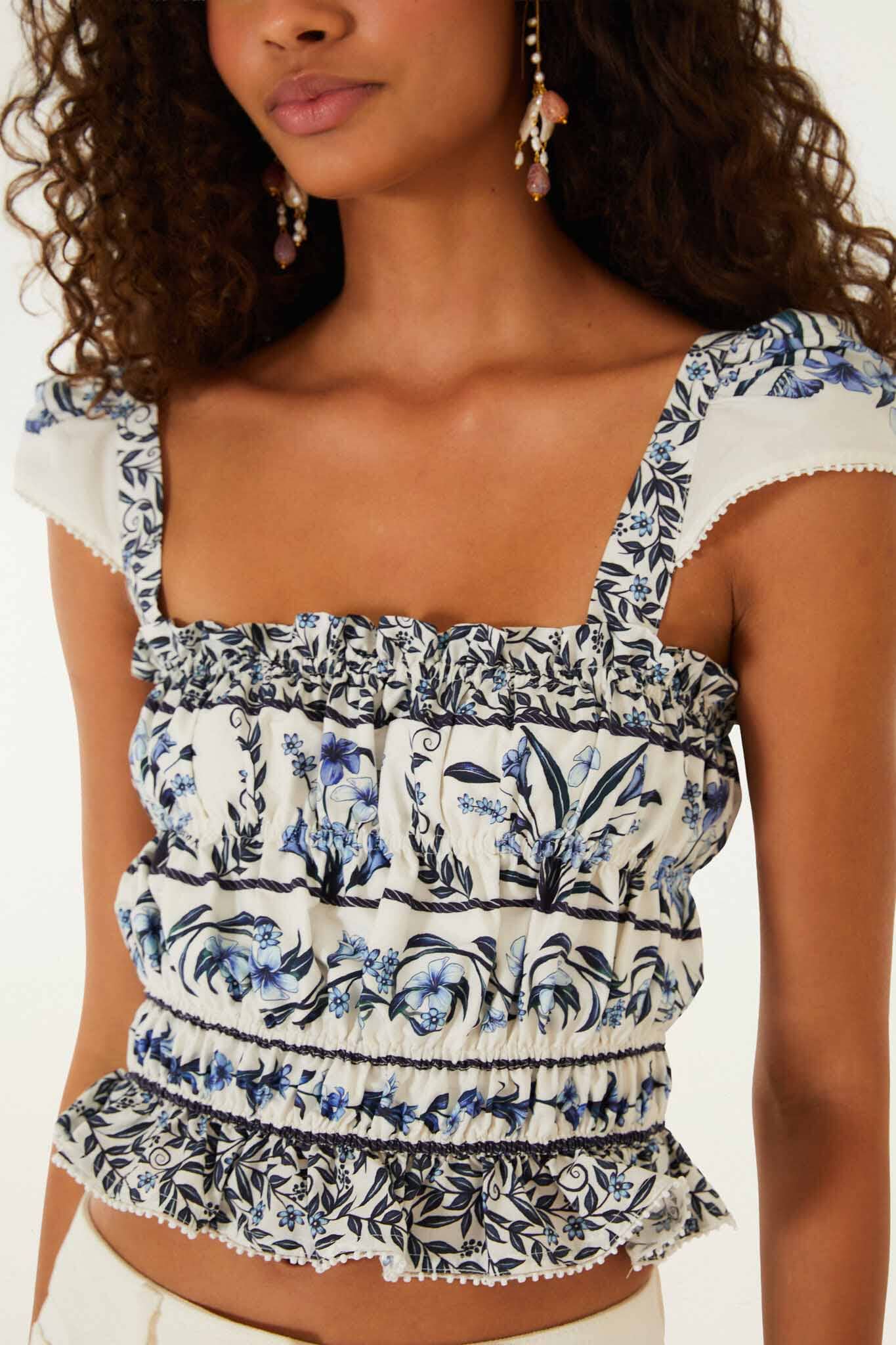 FARM Rio model wearing the Off-White Flowers Arch Smocked Organic Cotton Blouse