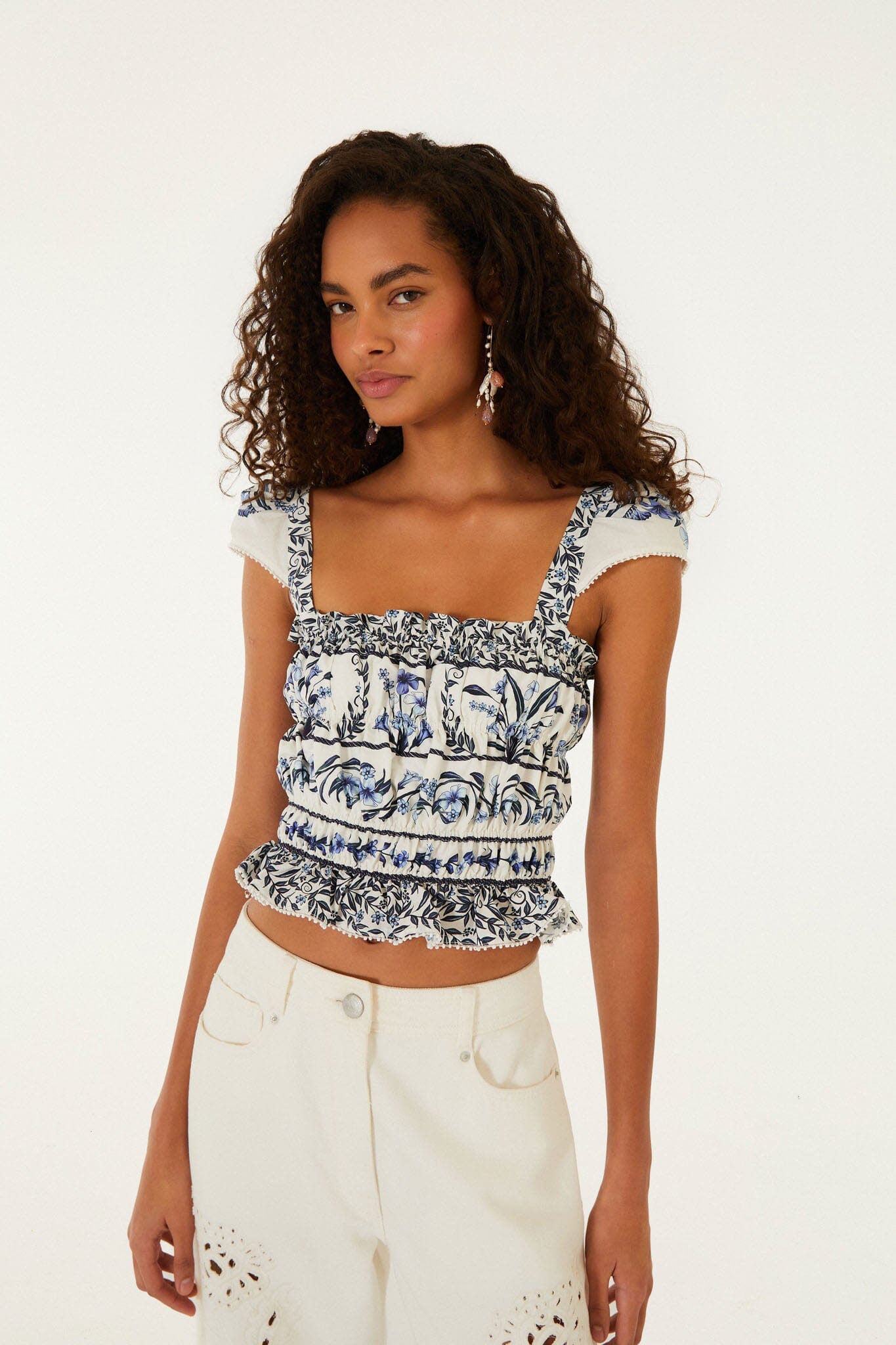 FARM Rio model wearing the Off-White Flowers Arch Smocked Organic Cotton Blouse