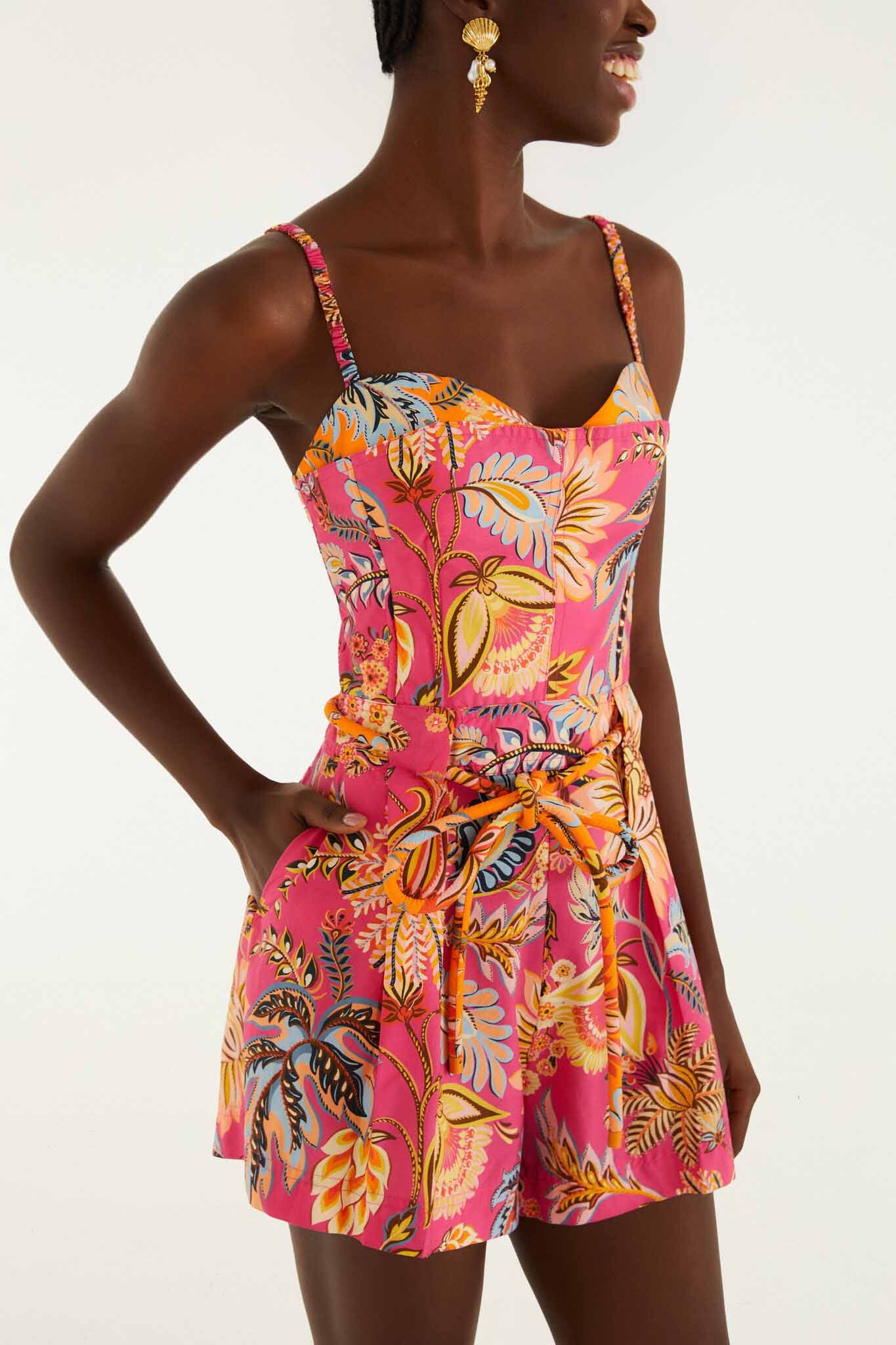 FARM Rio model wearing the Pink Ligia Floral Drawstring Organic Cotton Romper