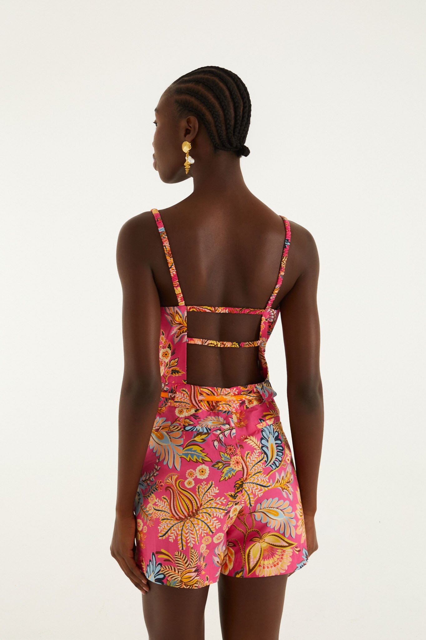 FARM Rio model wearing the Pink Ligia Floral Drawstring Organic Cotton Romper