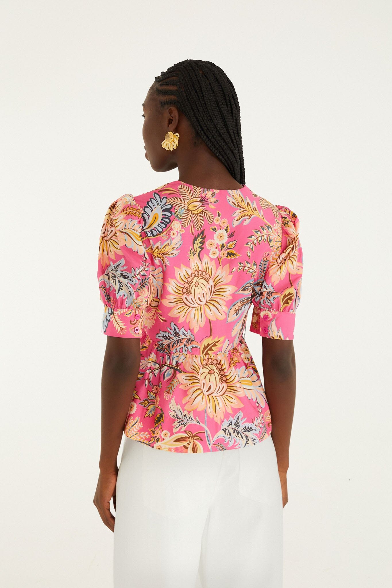 FARM Rio model wearing the Pink Ligia Floral Puff Sleeve Organic Cotton Blouse
