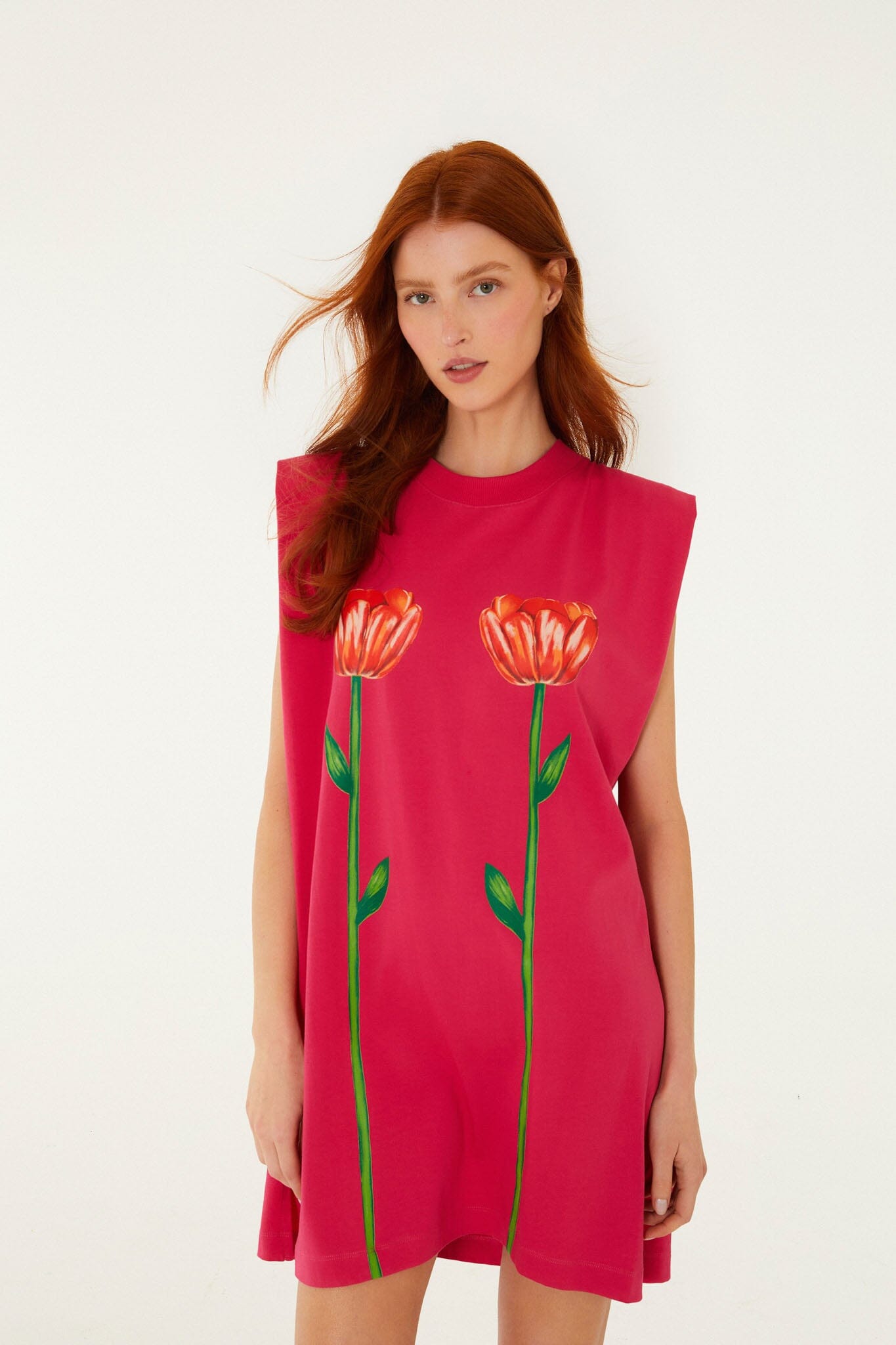 FARM Rio model wearing the Pink Tropical Rose Padded Shoulders Organic Cotton Mini Dress