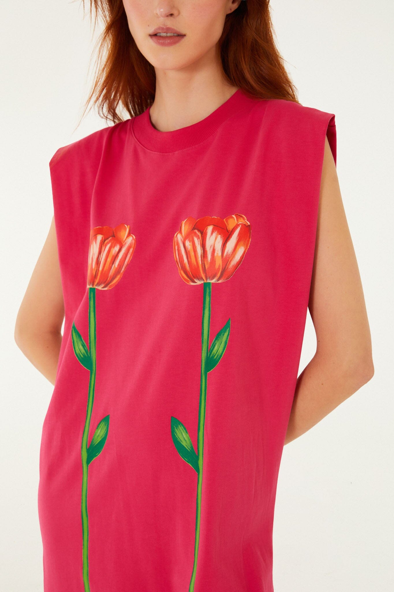 FARM Rio model wearing the Pink Tropical Rose Padded Shoulders Organic Cotton Mini Dress