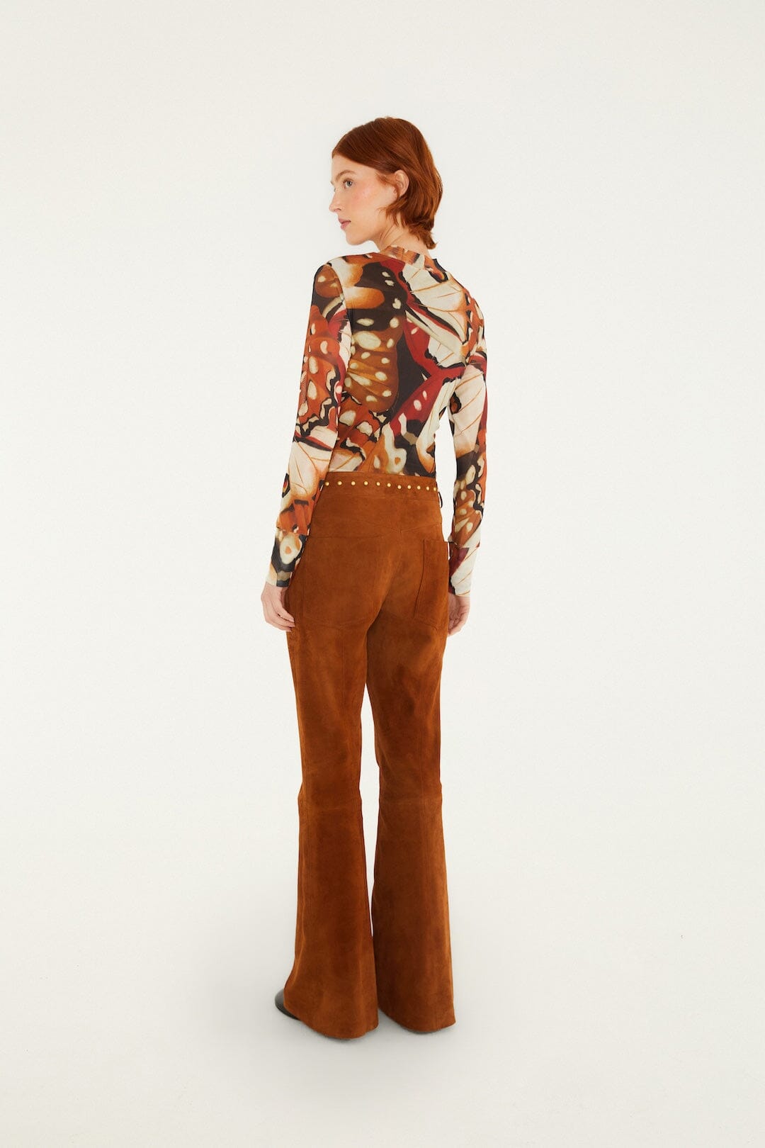 FARM Rio model wearing the Riveted Flare Leather Trousers