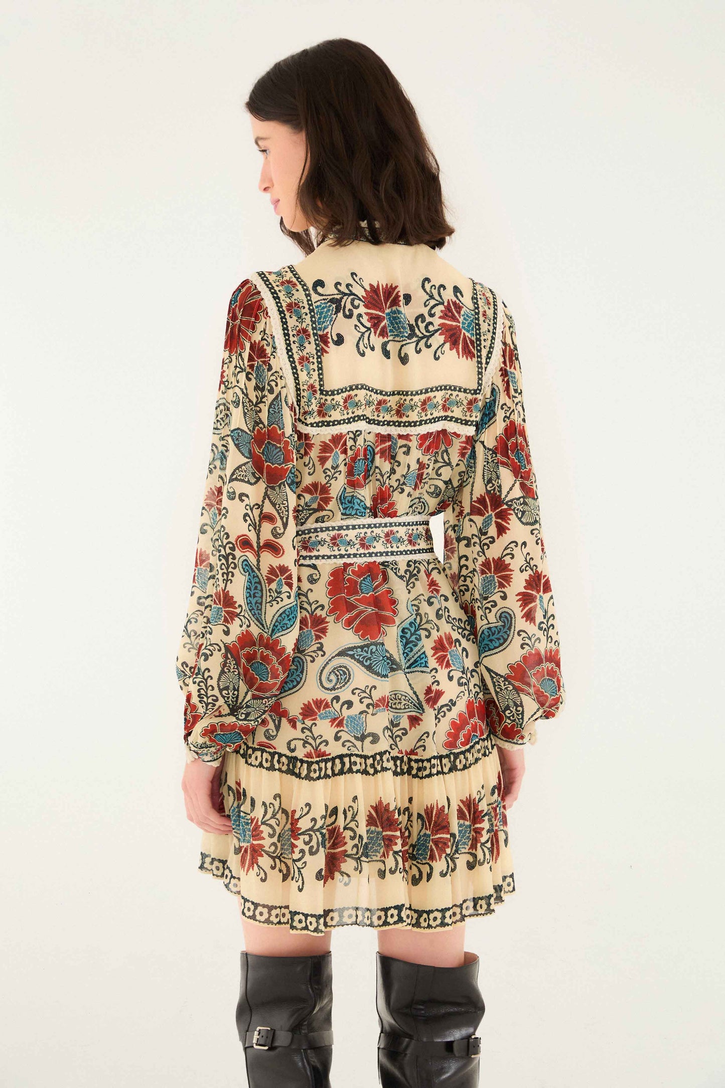 FARM Rio model wearing the Sand Francesca Long Sleeve Mini Dress