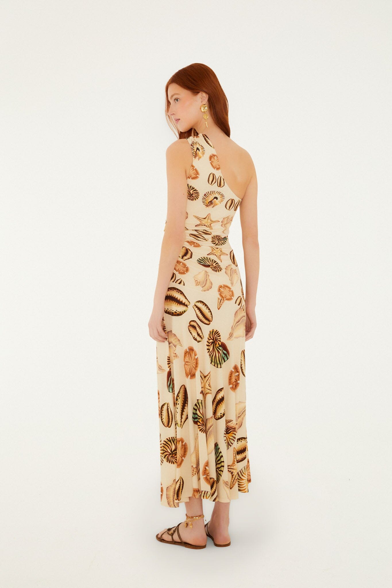 FARM Rio model wearing the Sand Marine Shells Tassel One-Shoulder Maxi Dress
