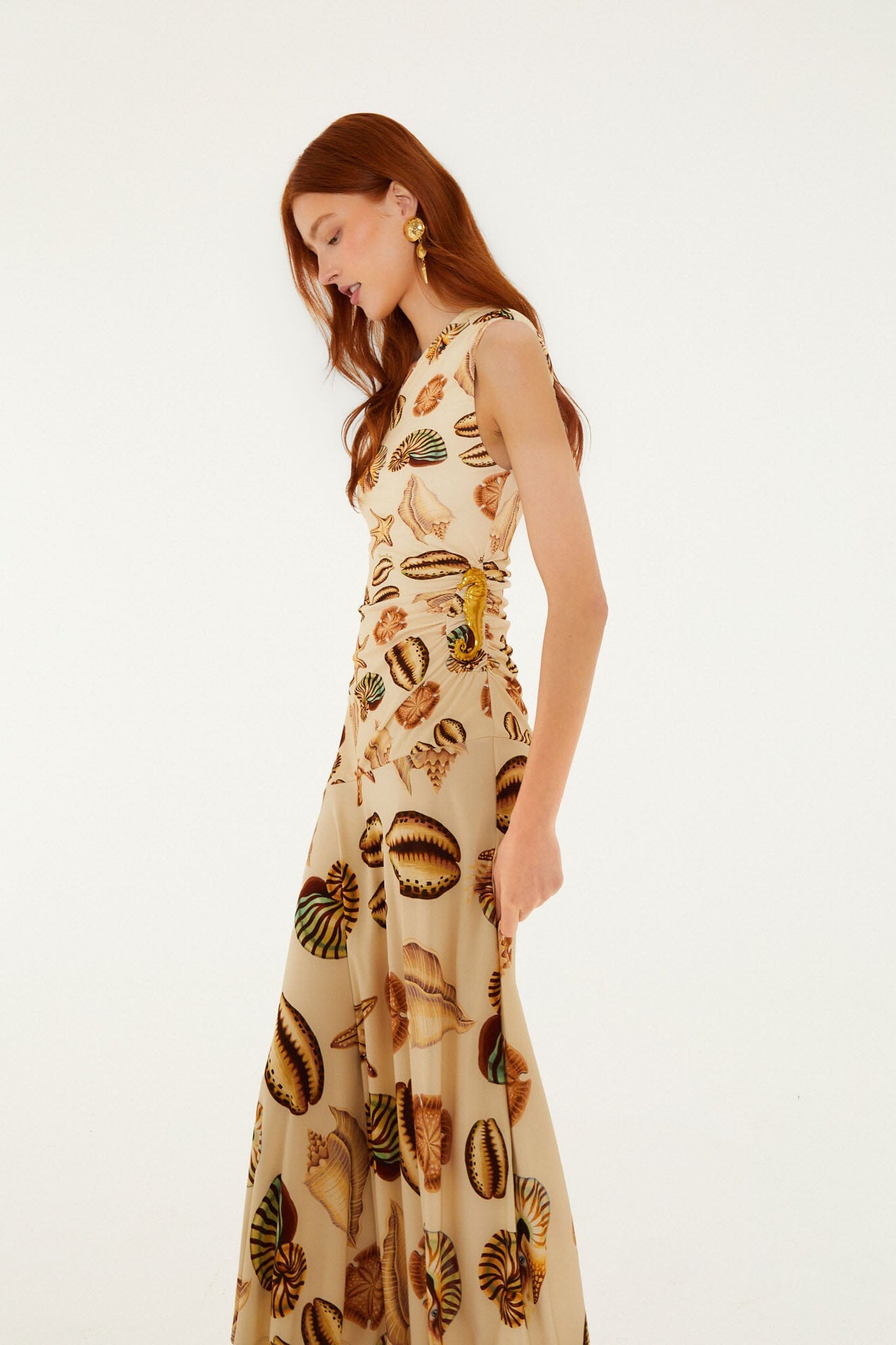 FARM Rio model wearing the Sand Marine Shells Tassel One-Shoulder Maxi Dress