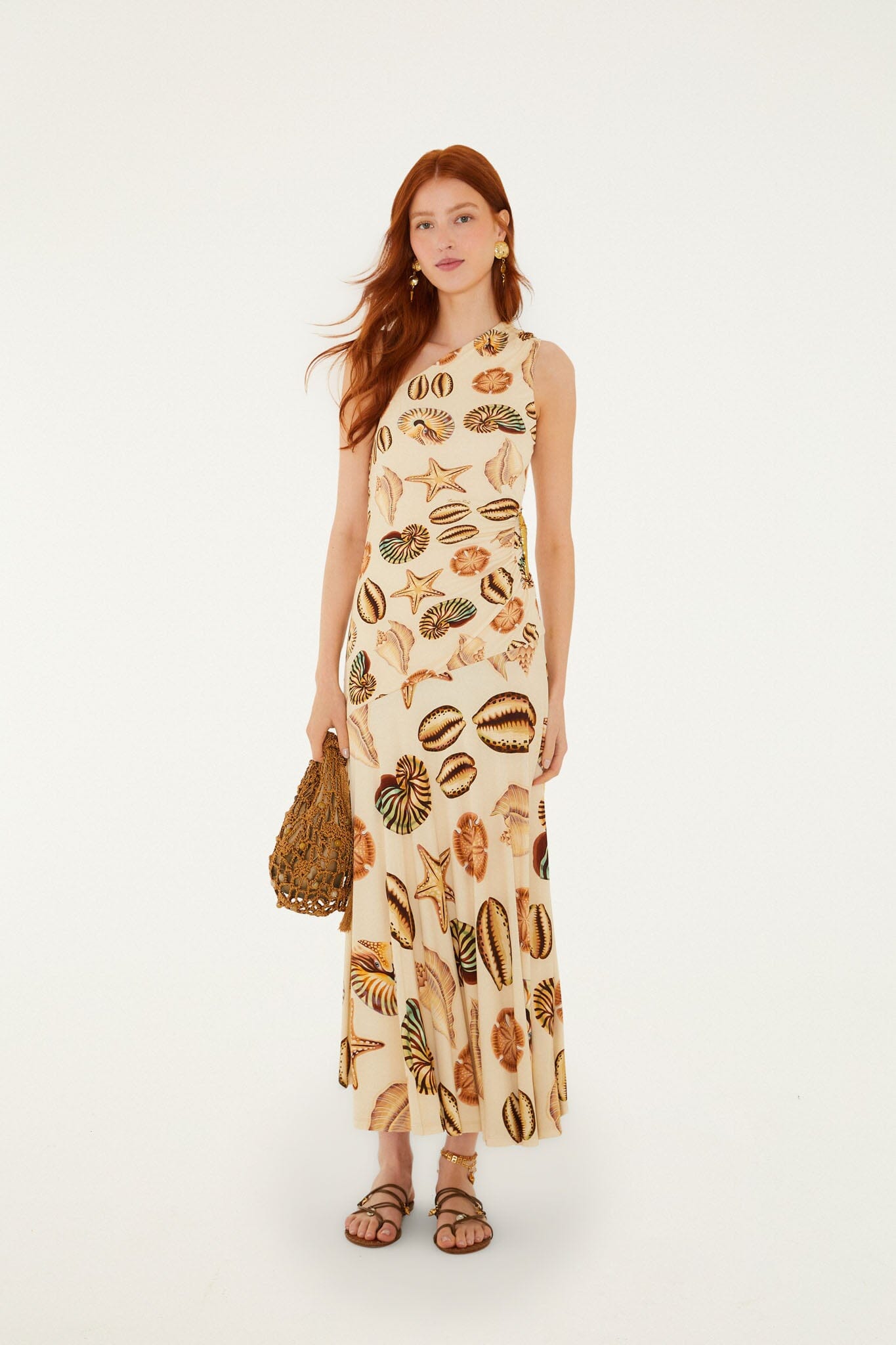 FARM Rio model wearing the Sand Marine Shells Tassel One-Shoulder Maxi Dress