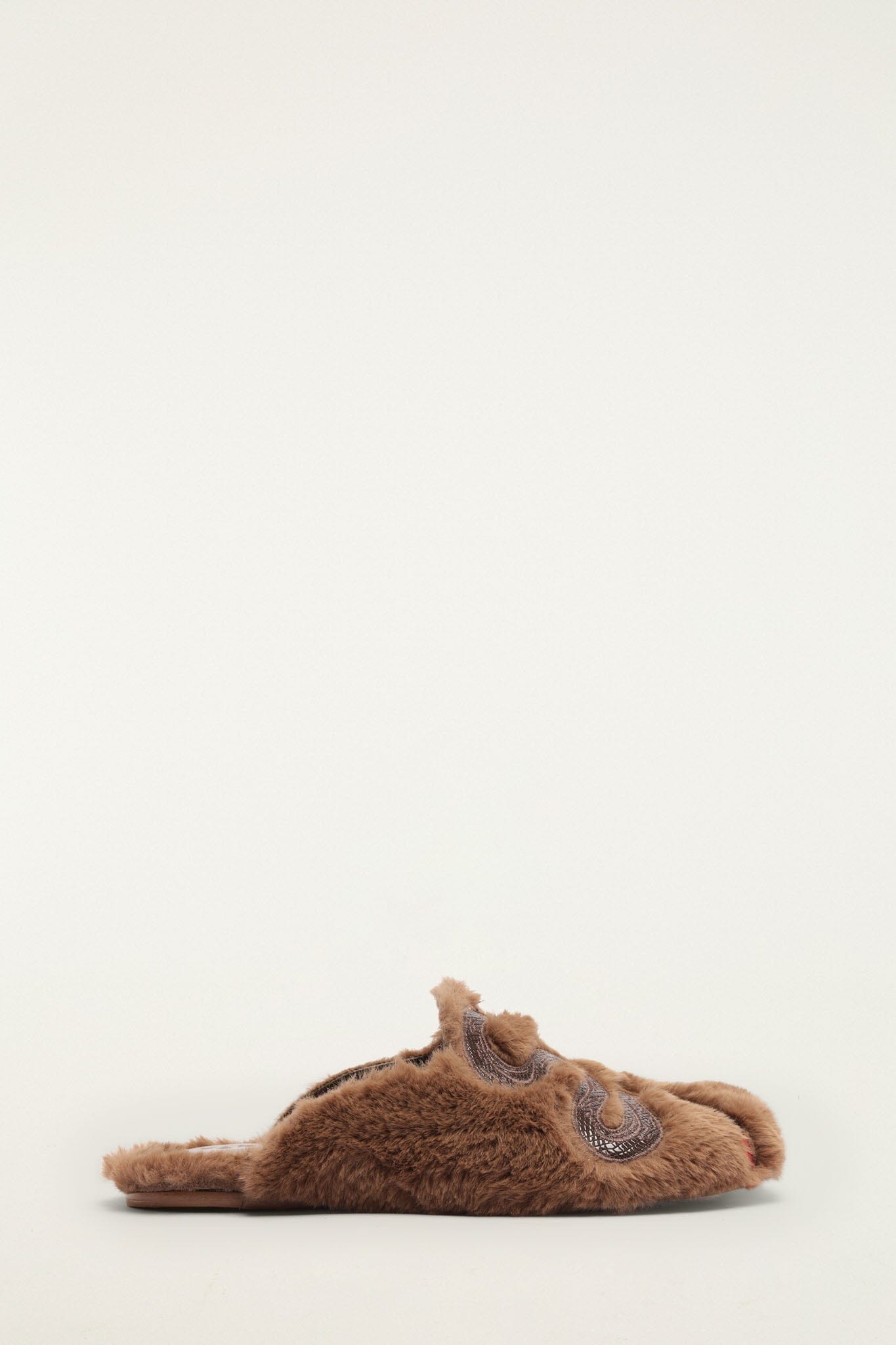FARM Rio model wearing the Shearling Snake Mule