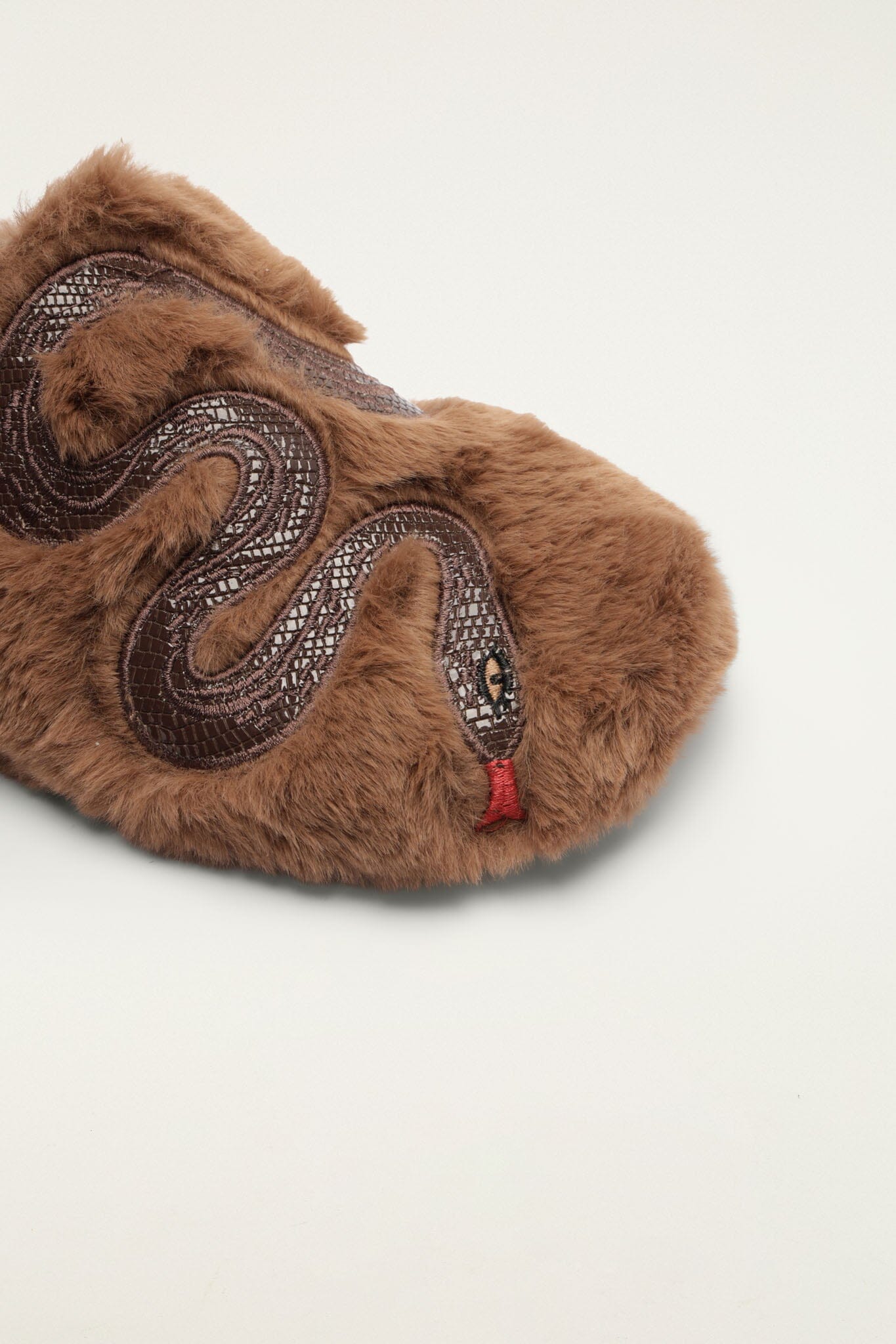 FARM Rio model wearing the Shearling Snake Mule