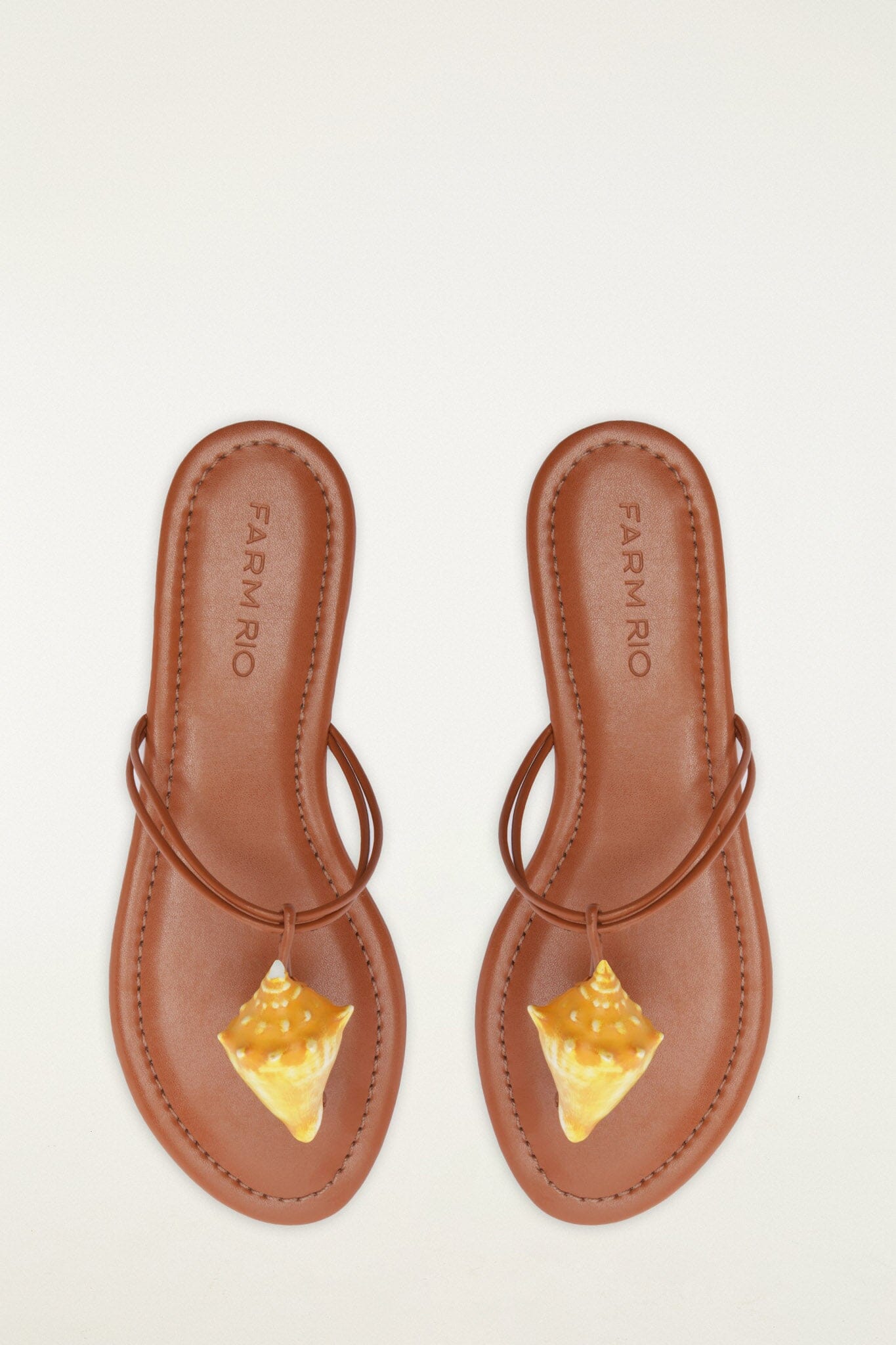 FARM Rio model wearing the Shell Flat Sandal